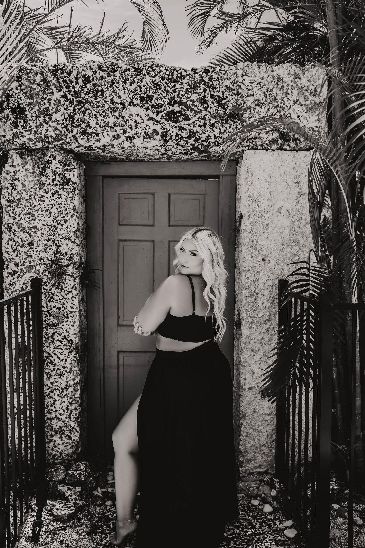 black-and-white images of a woman looking over her shoulder in a modern boudoir studio