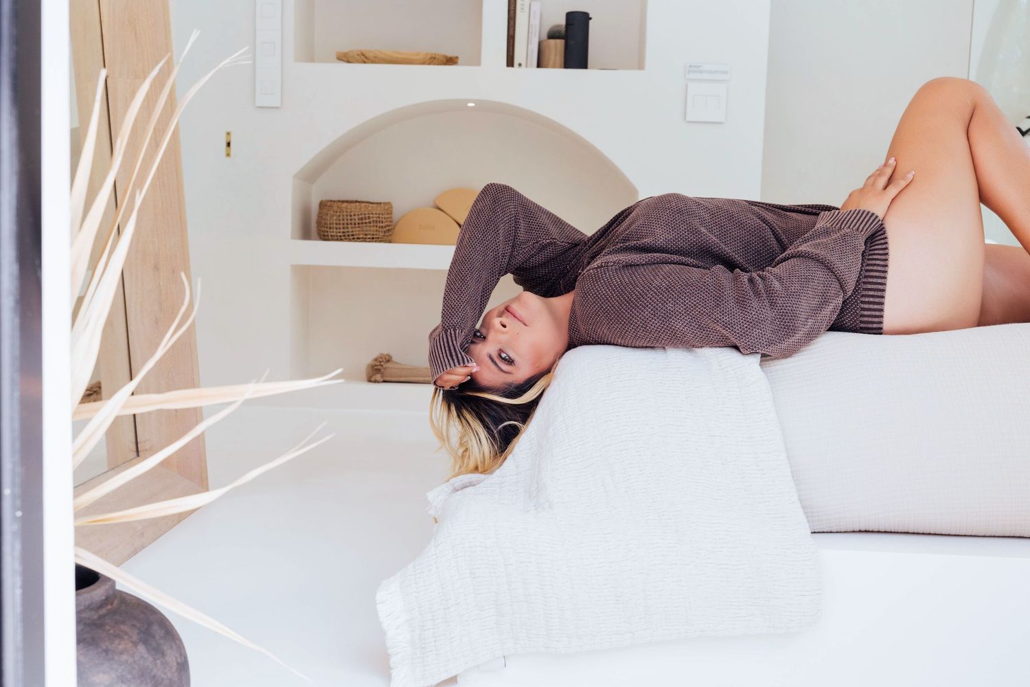 an intimate boudoir session in Sarasota, FL of a woman in bed.