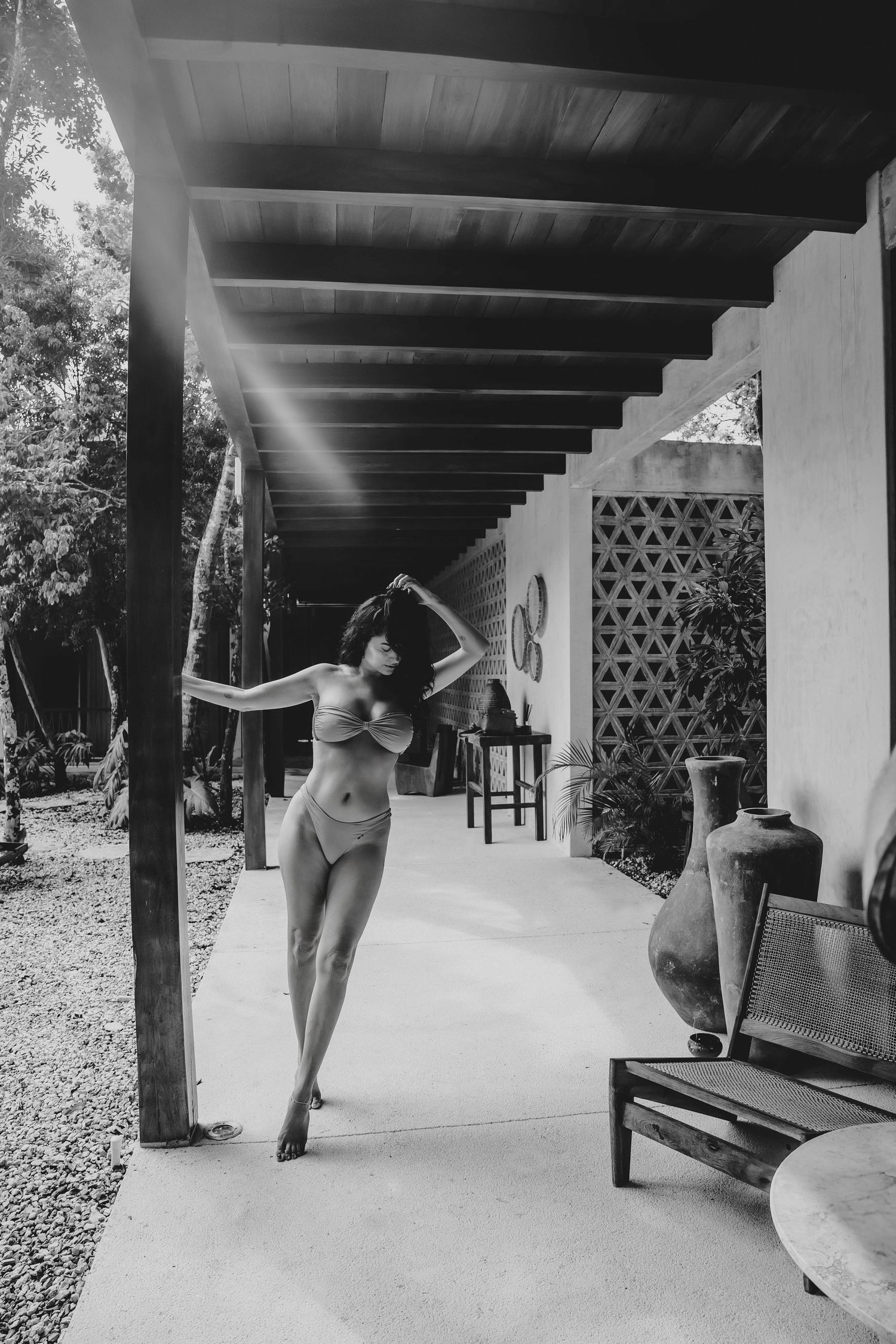 Black-and-white woman wearing a bikini in Tulum for an intimate session