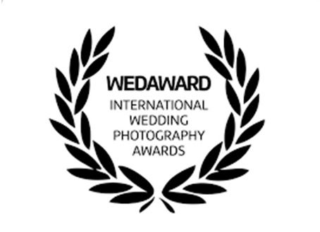 Black and white logo for WEDAWARD International Wedding Photography Awards with laurel wreath design.