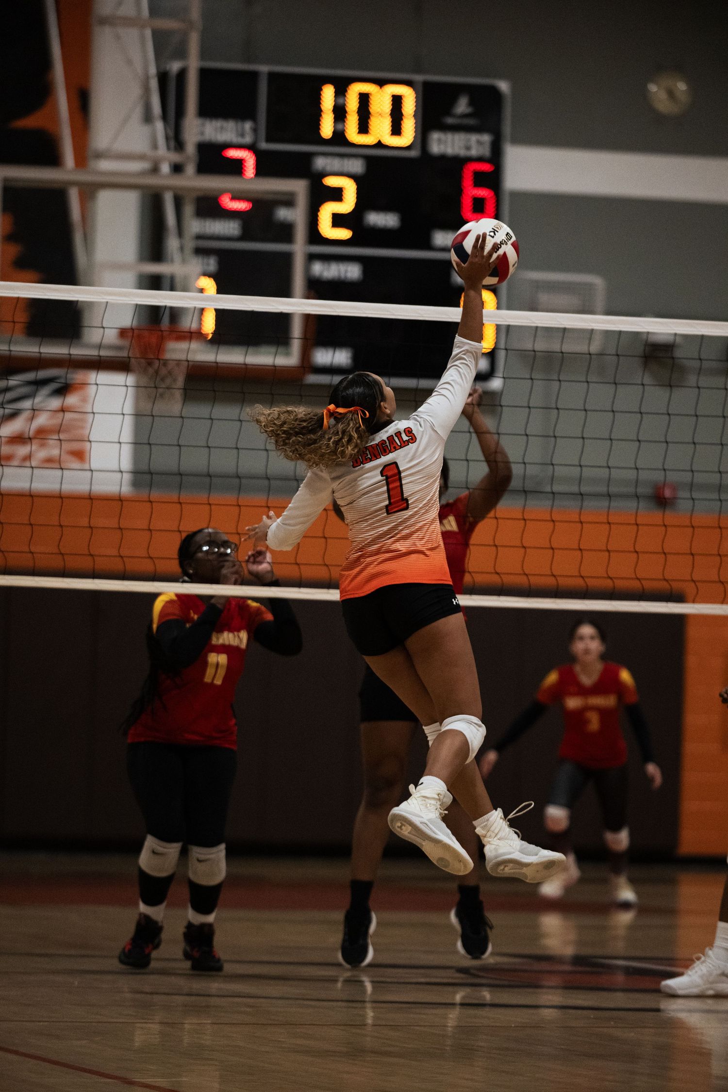 Piper High School girls volleyball player spikes the ball during game in Sunrise, FL.