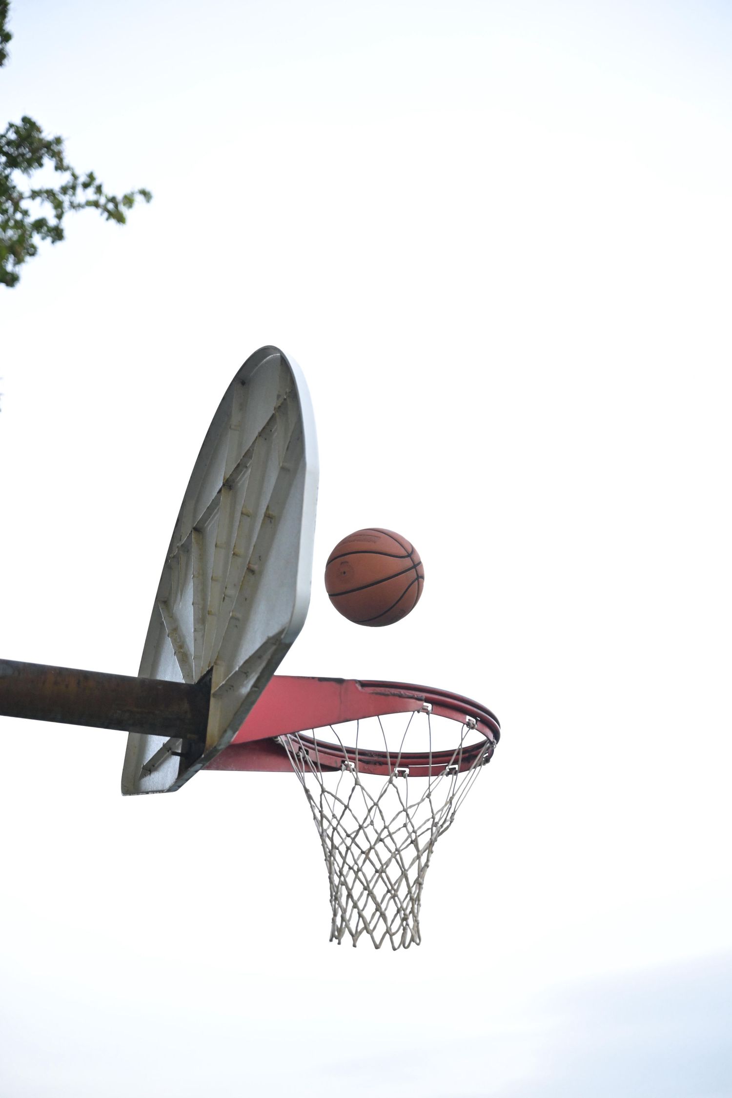 Basketball hovering above the rim after it was shot at a park in Lauderhill, Florida - Fort Lauderdale Photographer