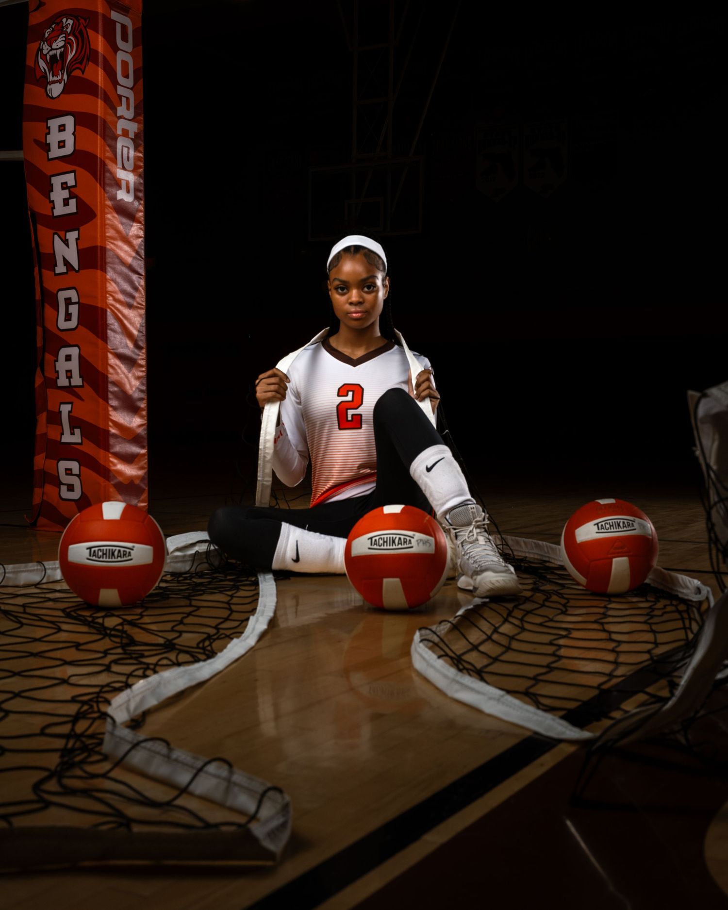 Indoor volleyball gym scene with orange and white balls – Fort Lauderdale athlete branding photographer