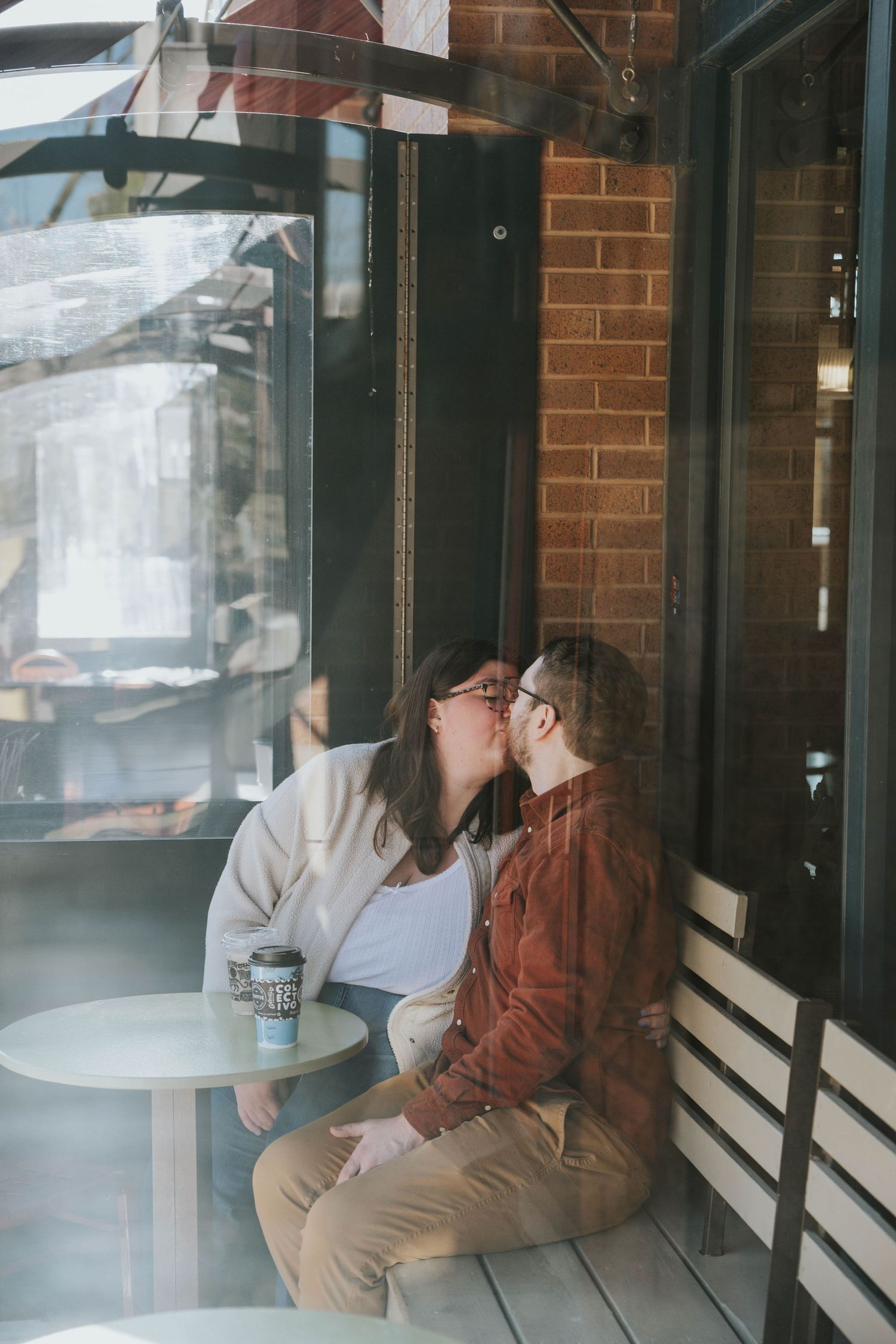 Series of intimate cafe moments captured through window reflections.