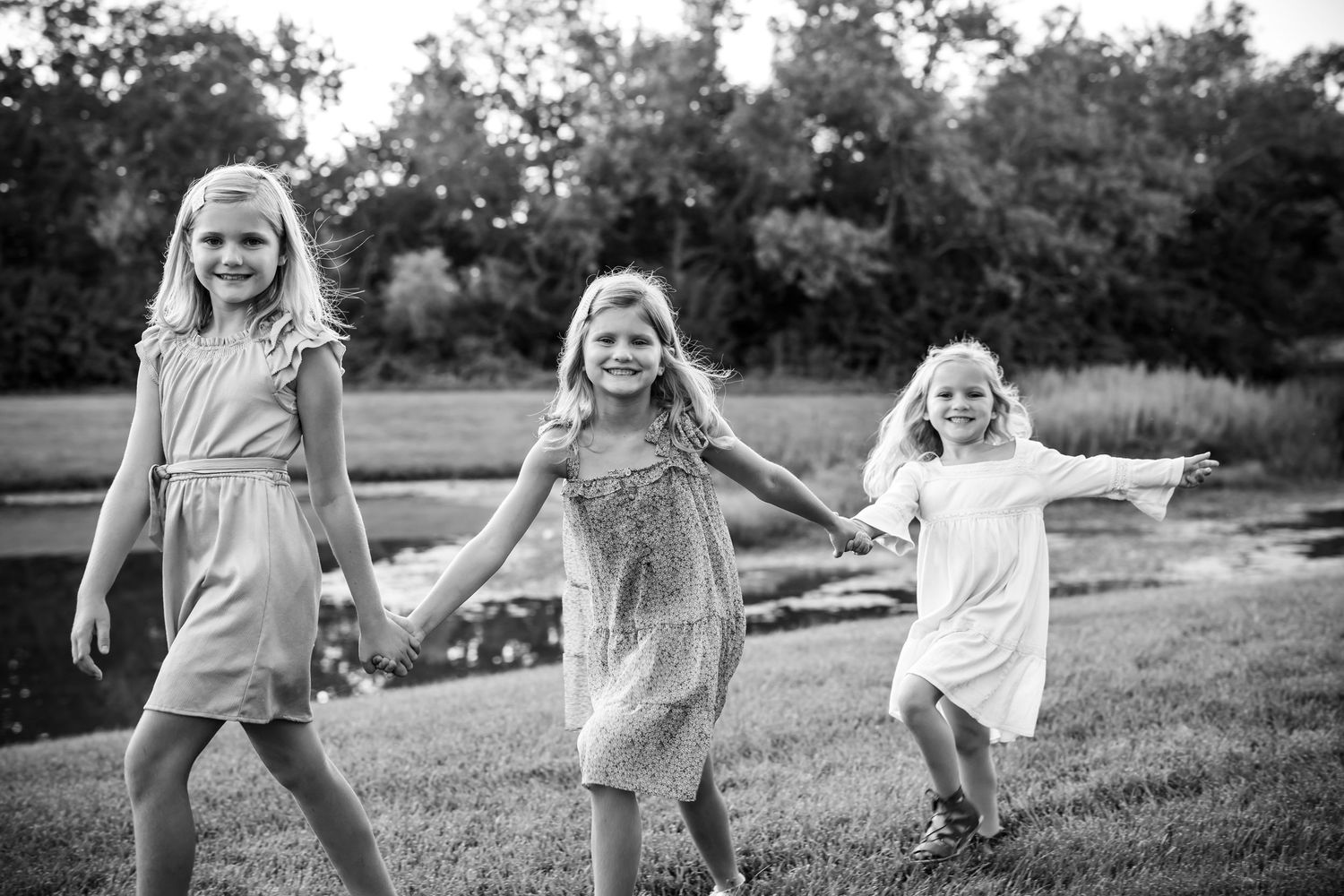 sisters holding hands, walking in a line