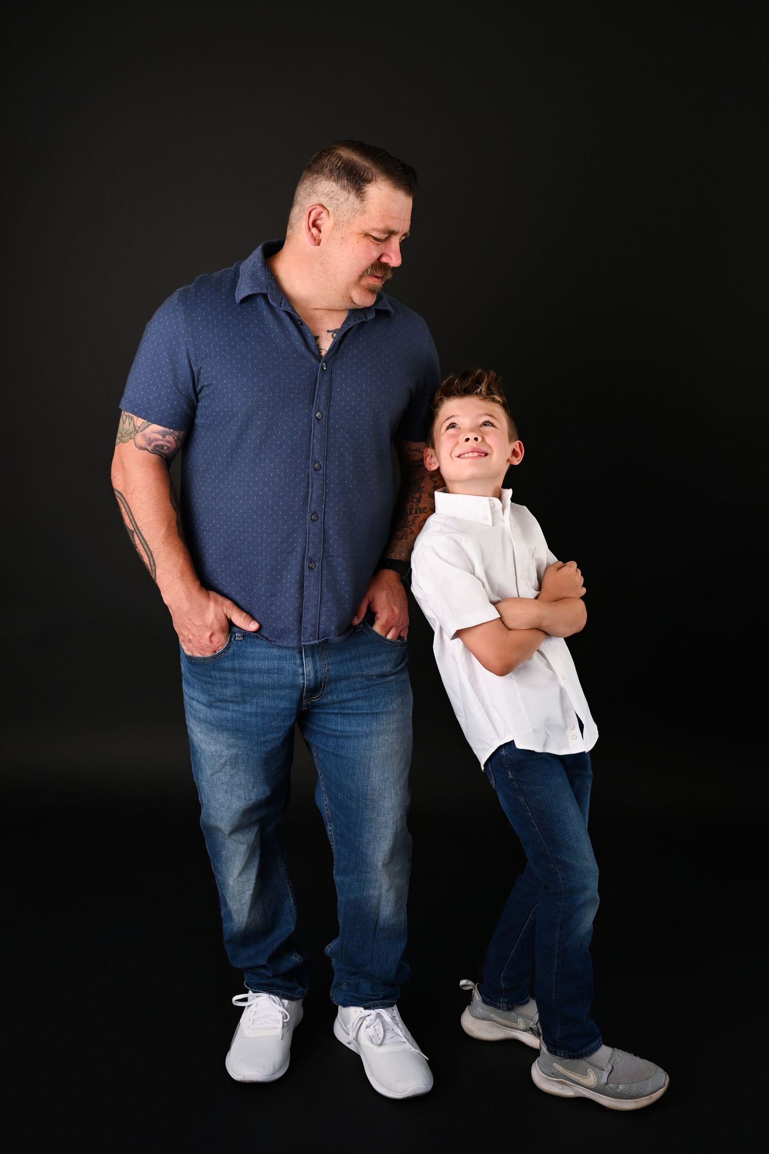 Son leaning up against Dad in Fathers Day Mini Session