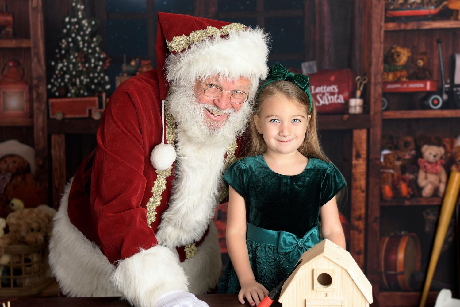 Santa Claus and child smiling in Christmas North Pole Santa's Workshop Mini Session Gilbert Tempe Mesa Chandler San Tan Queen Creek Arizona