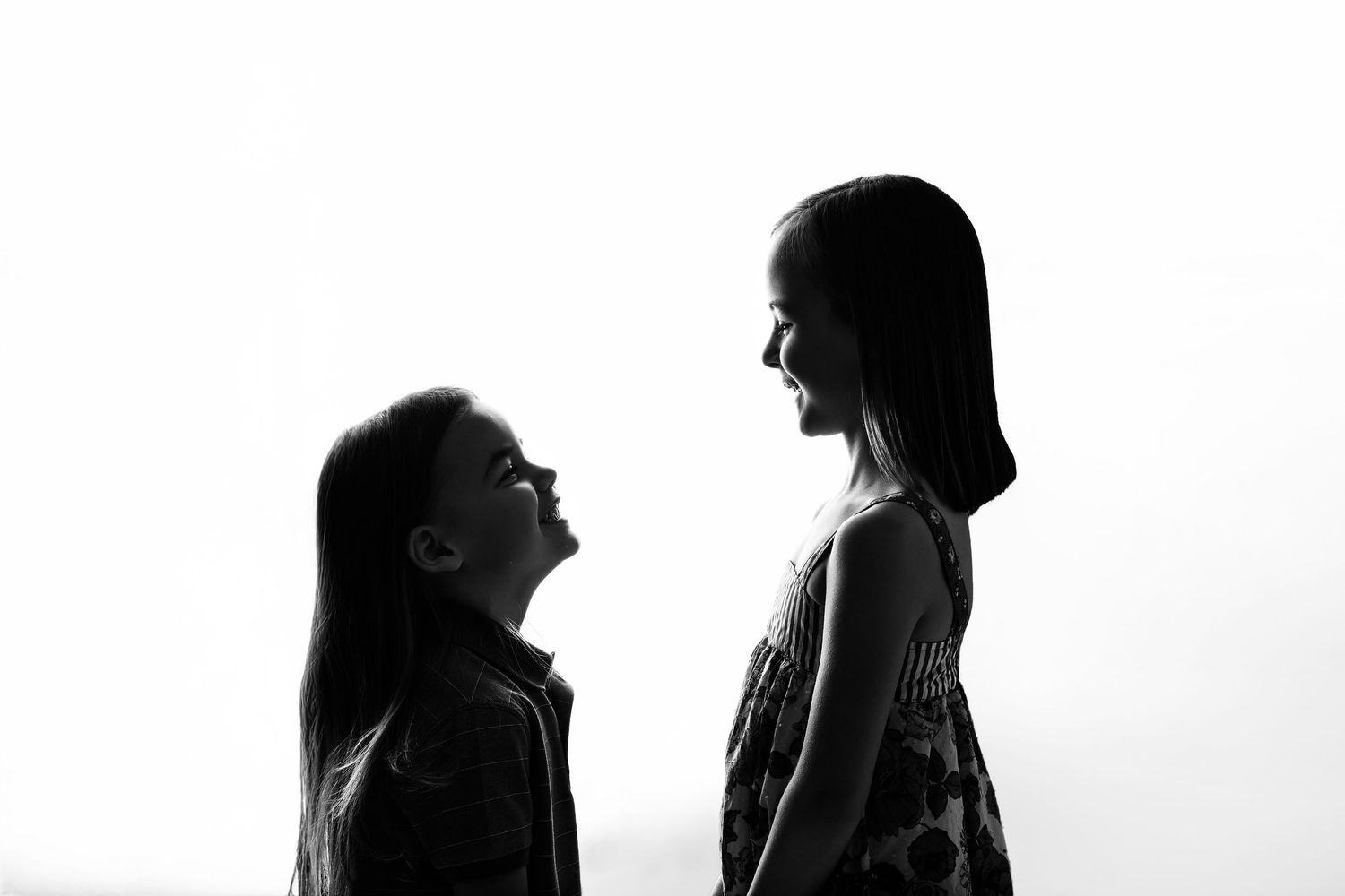 Ahwatukee Phoenix Arizona Silhouette image of siblings looking at each other