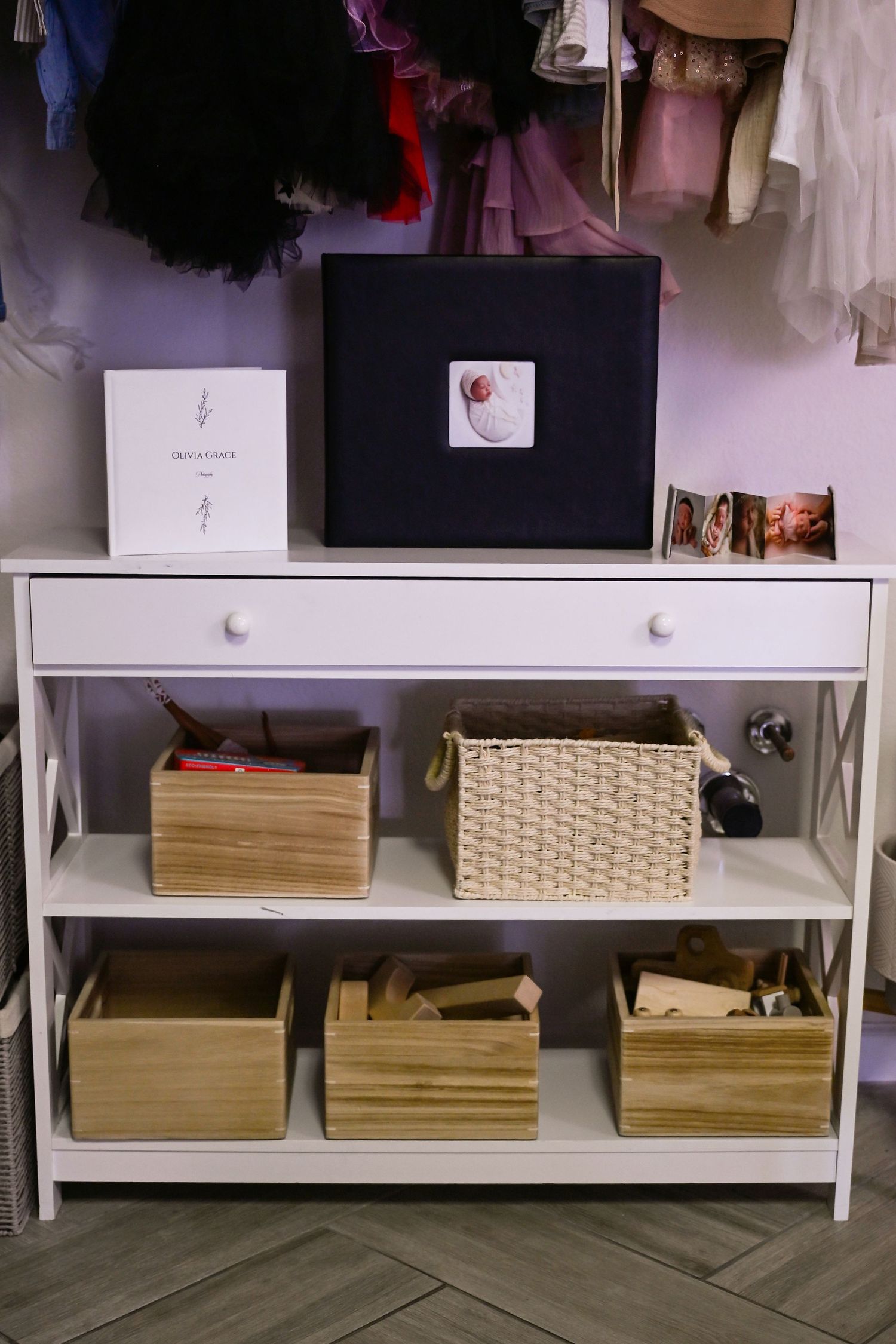 A client area at the Scottsdale Photography studio of Olivia Selin with Newborn photos and a client closet