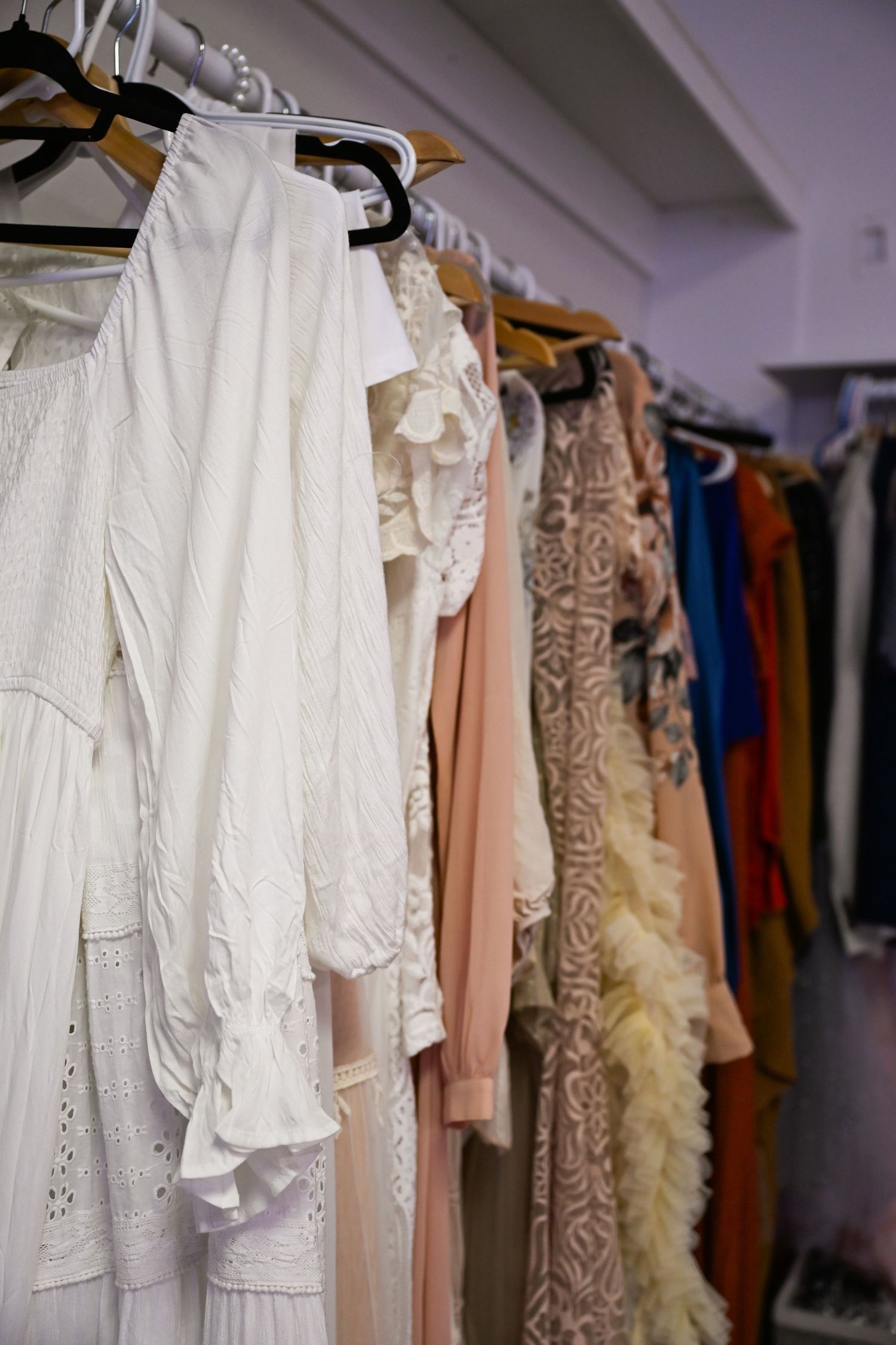 Client closet filled with Maternity Gowns for pregnant mothers to borrow from for free with their Maternity Photoshoot