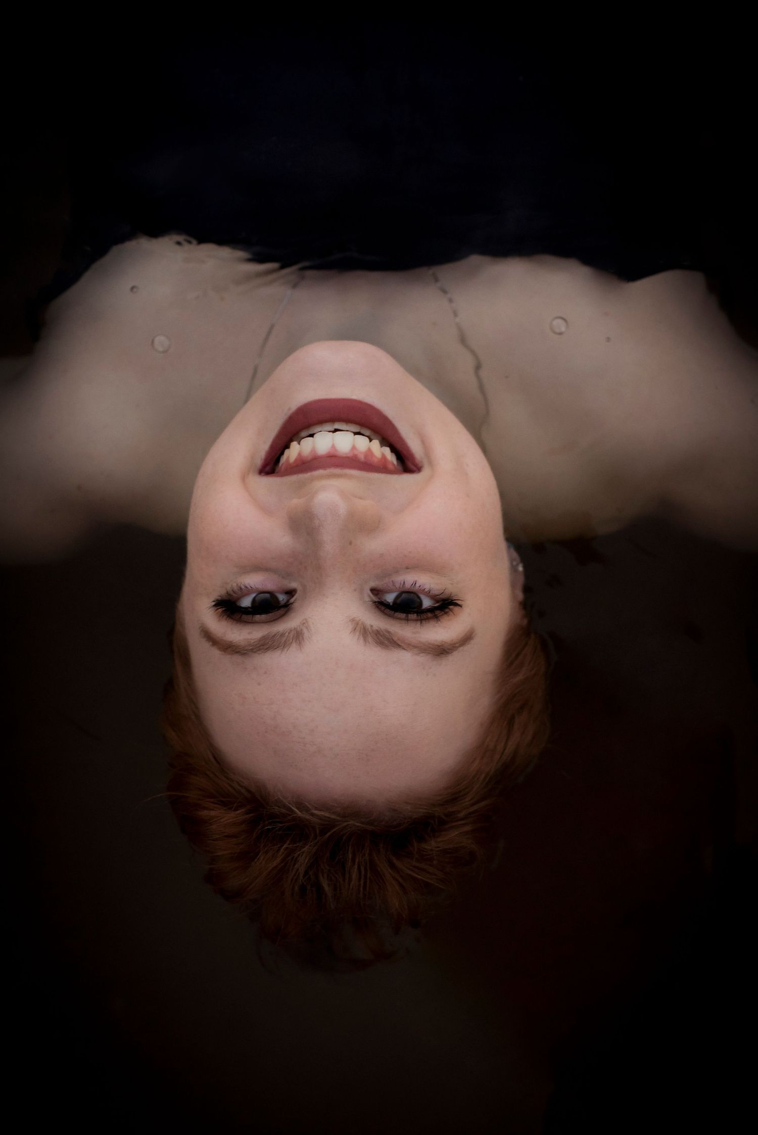 Floating in water swimmer arizona lake river salt river water moody senior photos affordable portrait services in Arizona