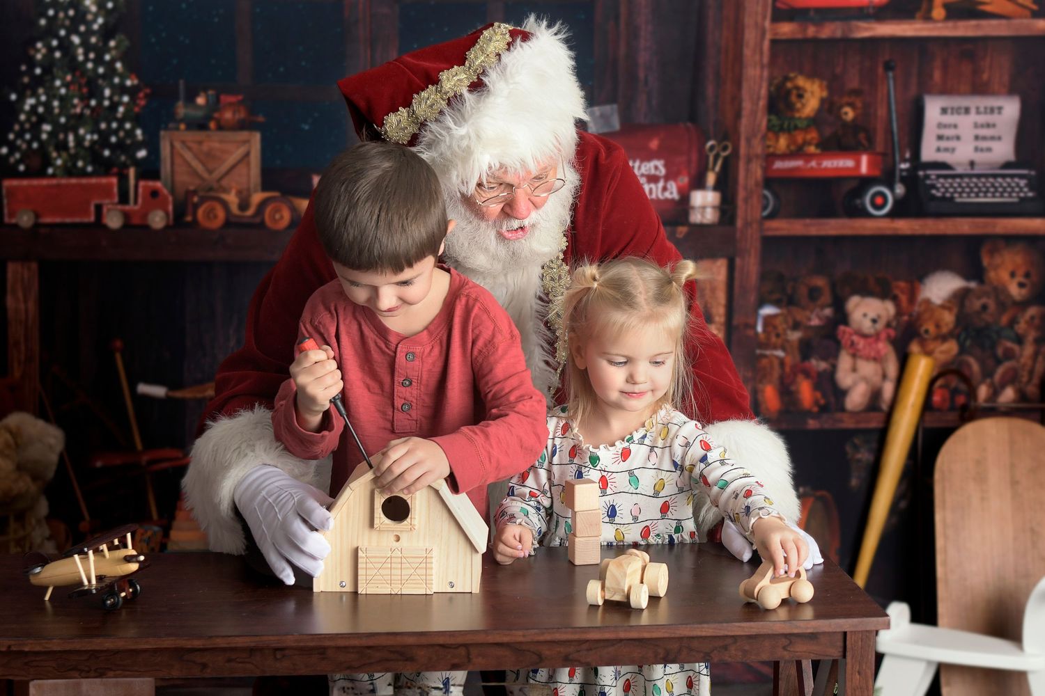 Santa Claus toy workshop Mini Session with two children building toys with santa in Arizona
