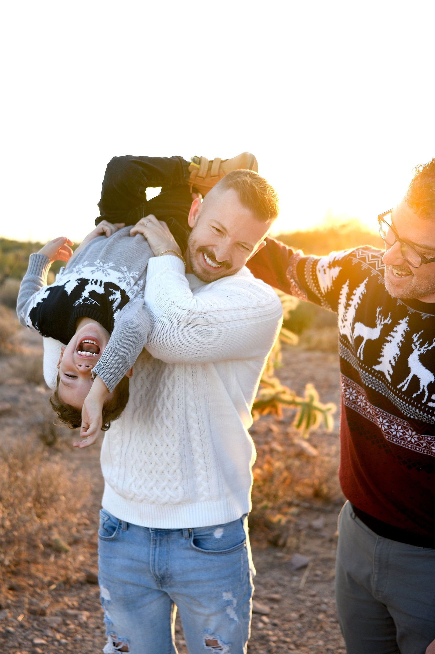 Gay couple and their sun candidly laughing in Gilbert Arizona at Golden hour