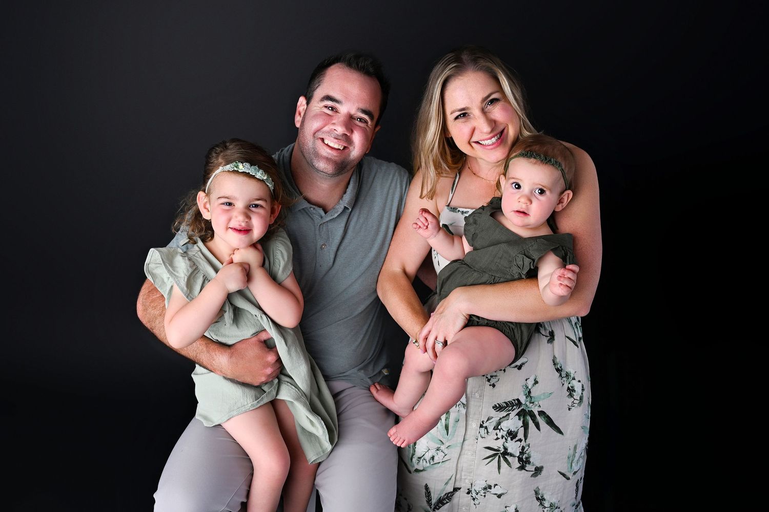 Family of four in photo studio for professional family photos in Arizona