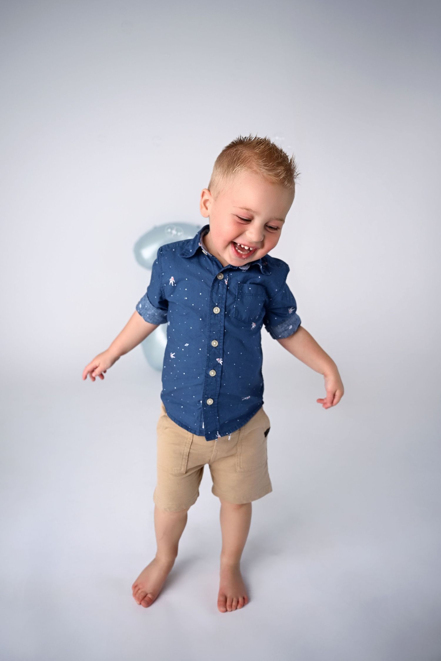 Laughing Candid image of little boy dancing