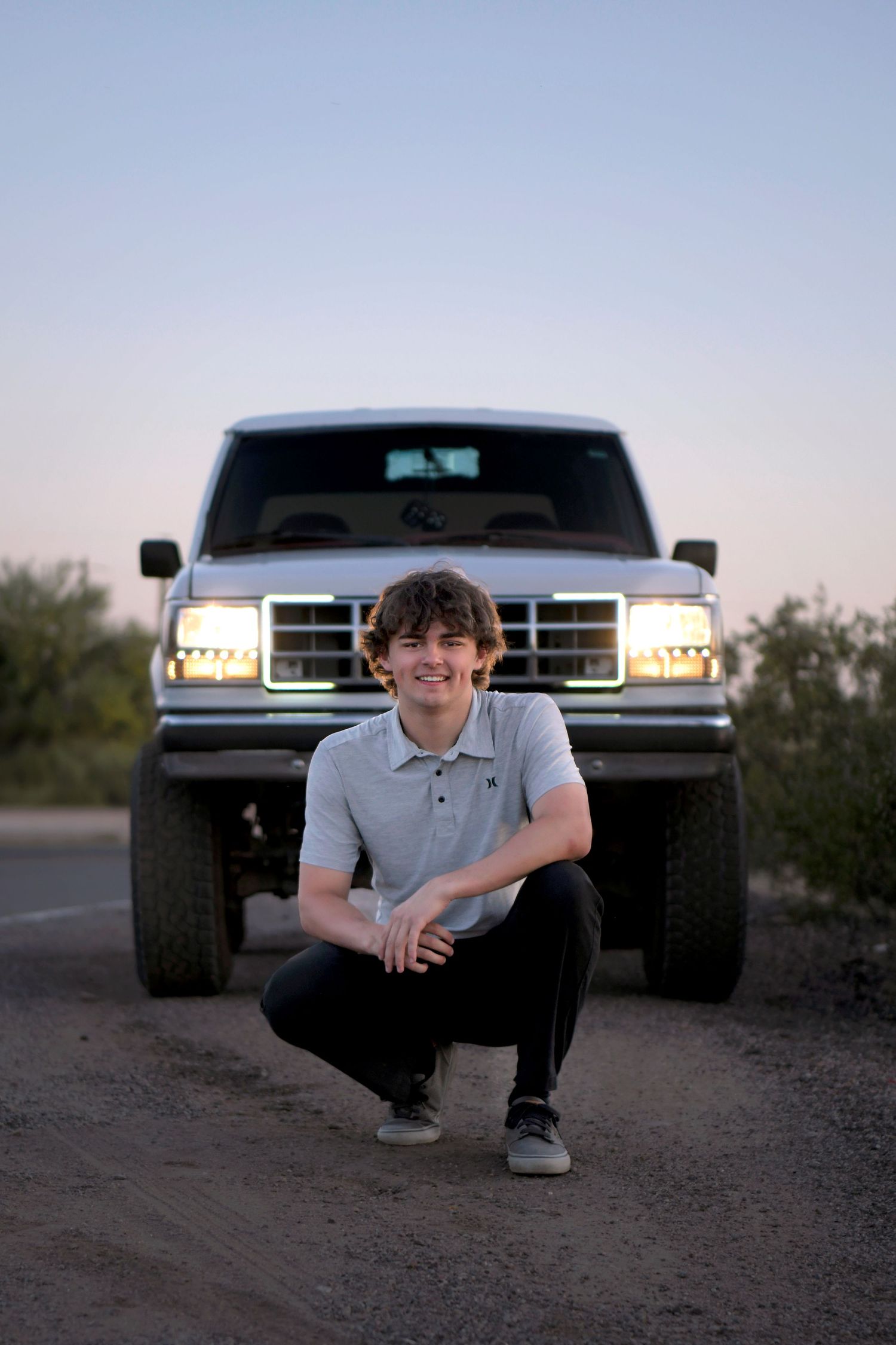 Headlights vintage car high school boy car photography senior graduation announcement photos in Arizona