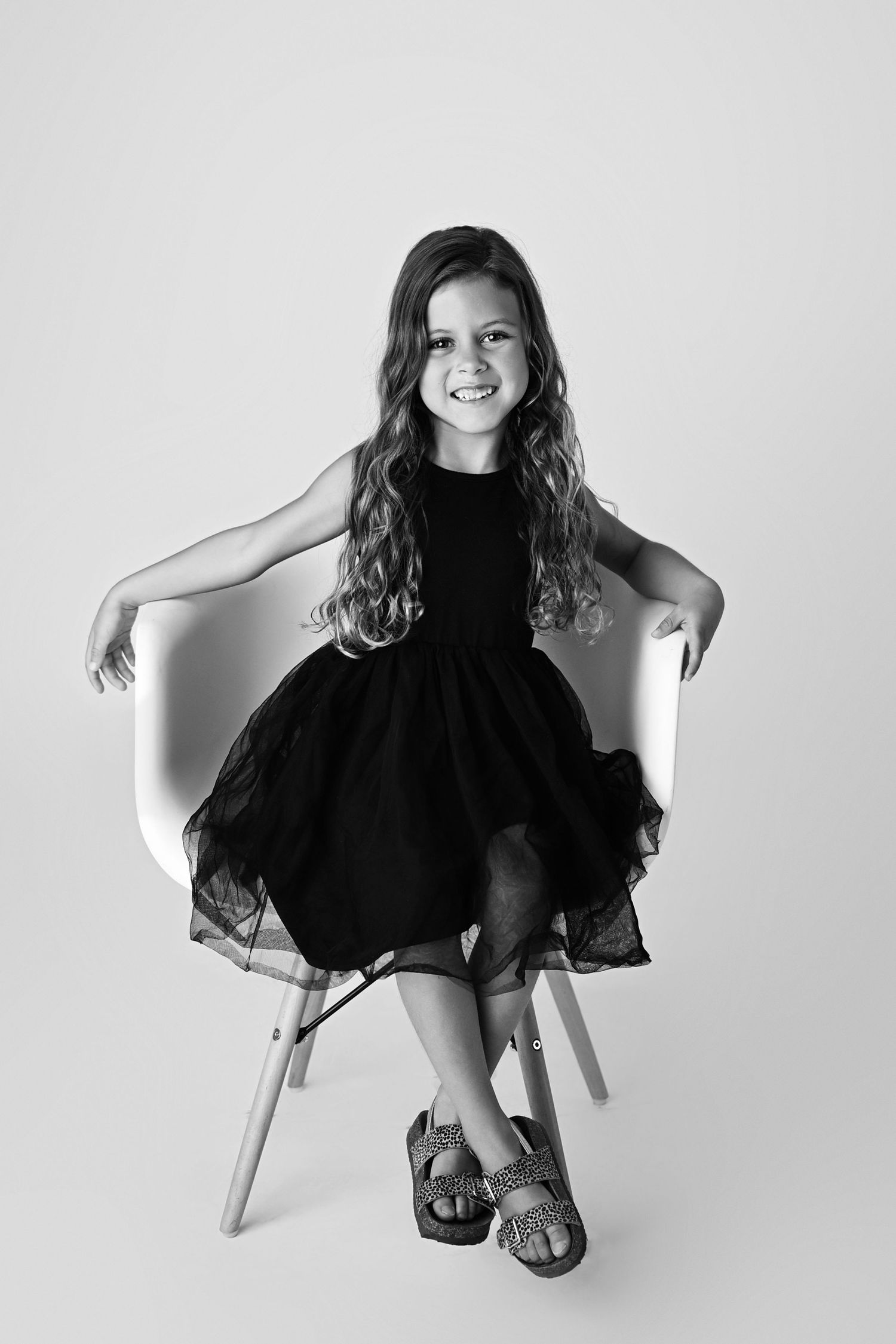 Black and White Personality Mini Session Portrait of young girl smiling in Arizona studio
