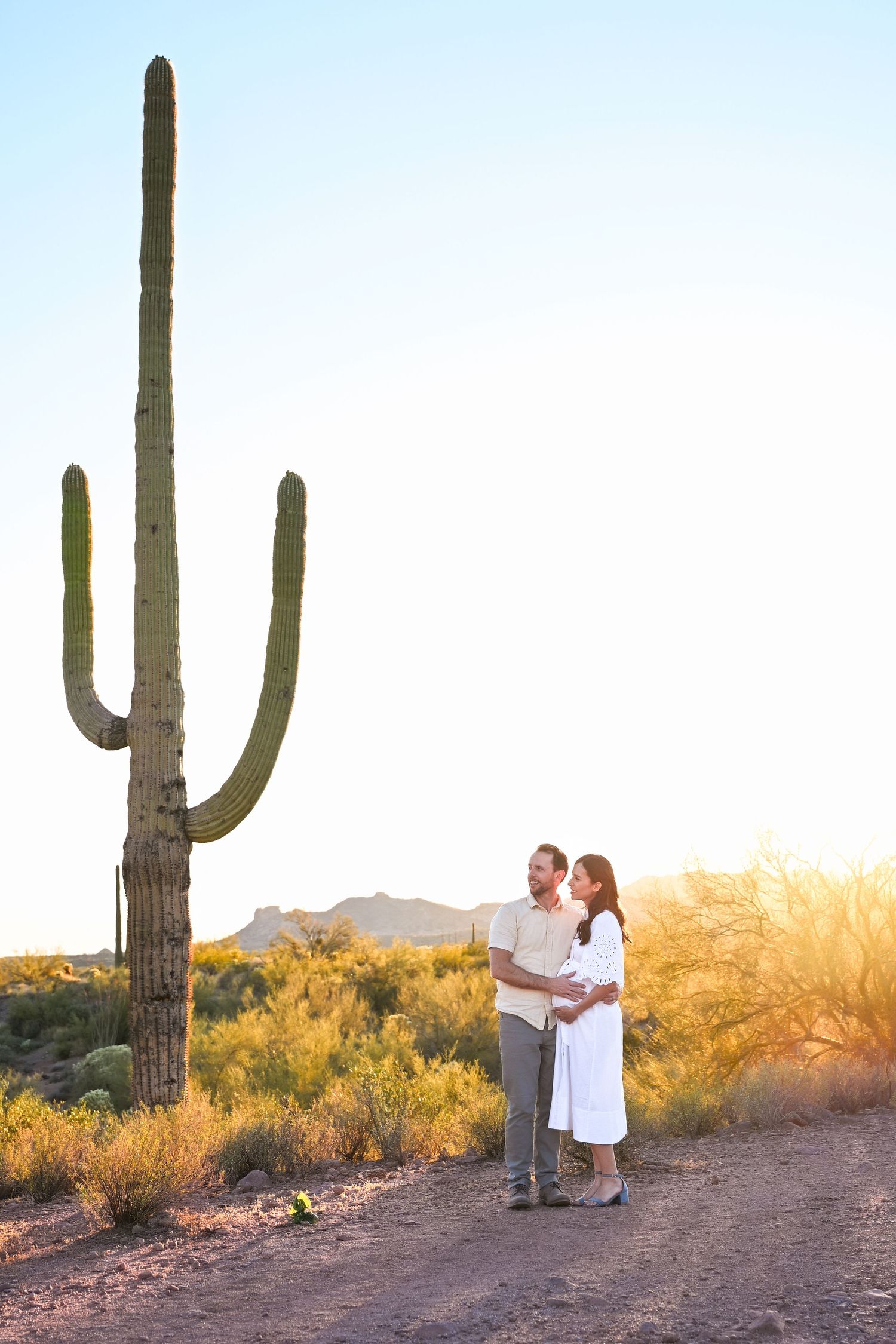 Peaceful outdoor session in an open desert vista next to a large saguaro cactus