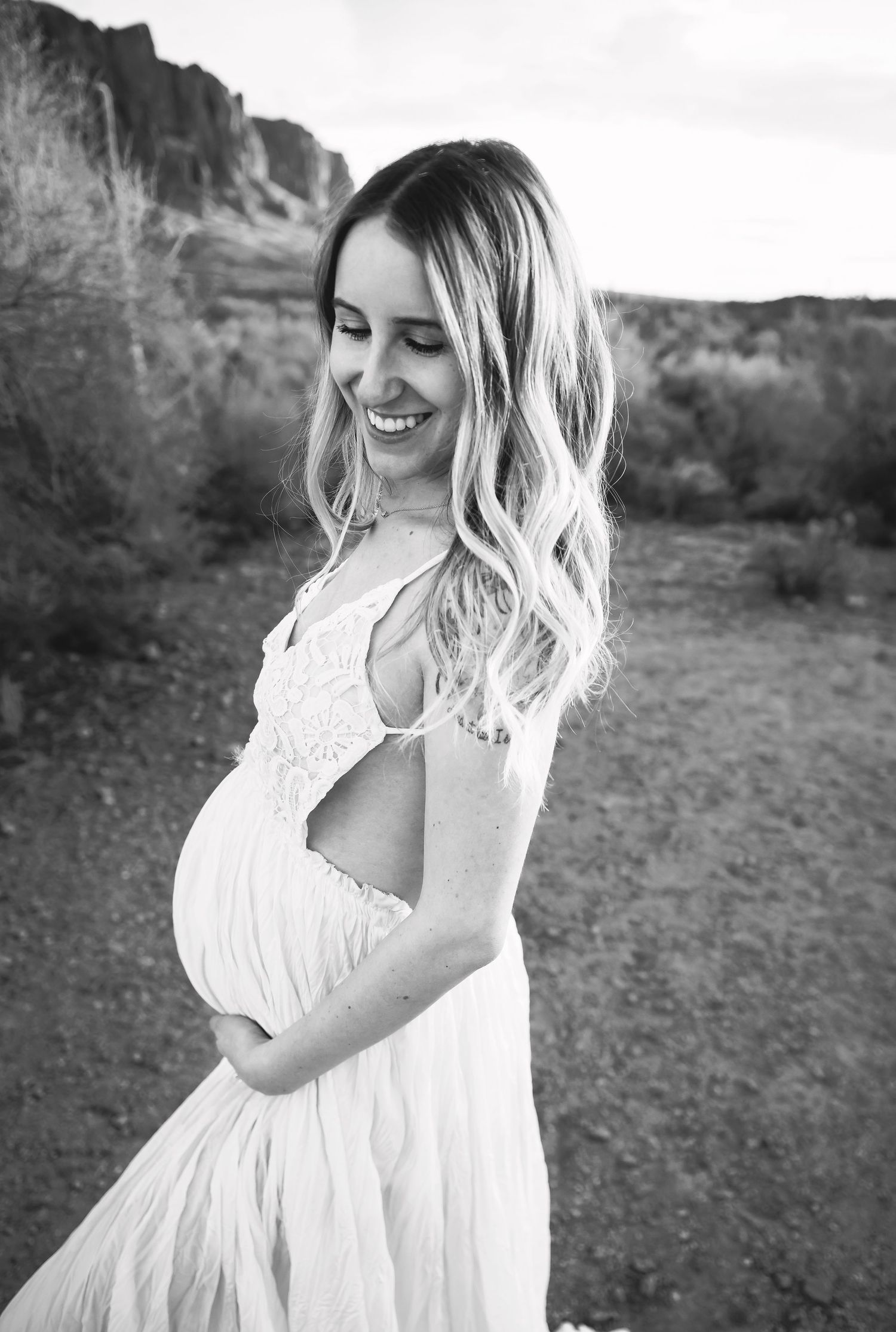 Black and white Maternity image in the Mesa Arizona Usery Mountains Woman is glowing