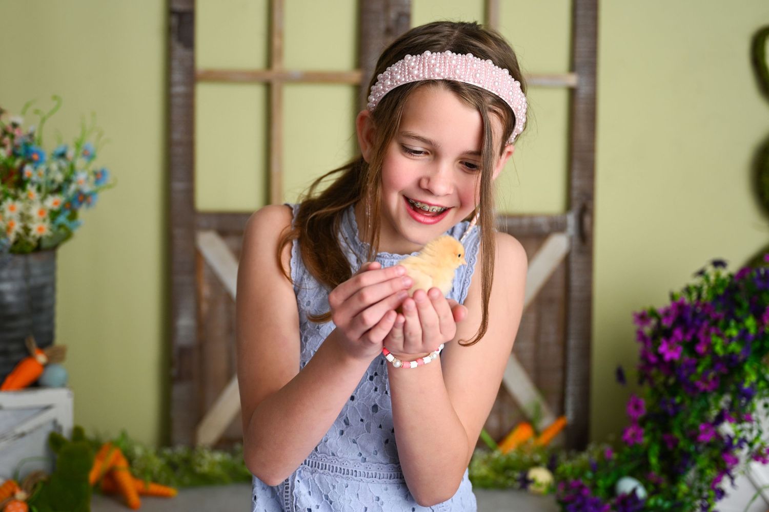Child holding chicks and ducklings for easter mini session in AZ