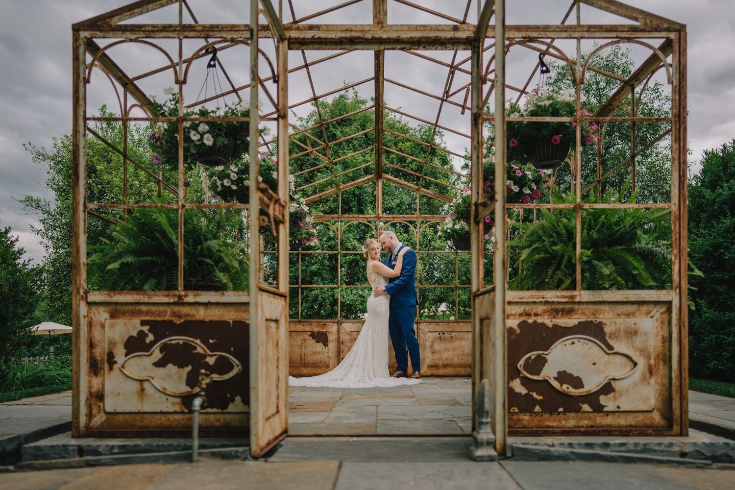 Couple sharing romantic moment in rustic greenhouse structure. Washington DC.