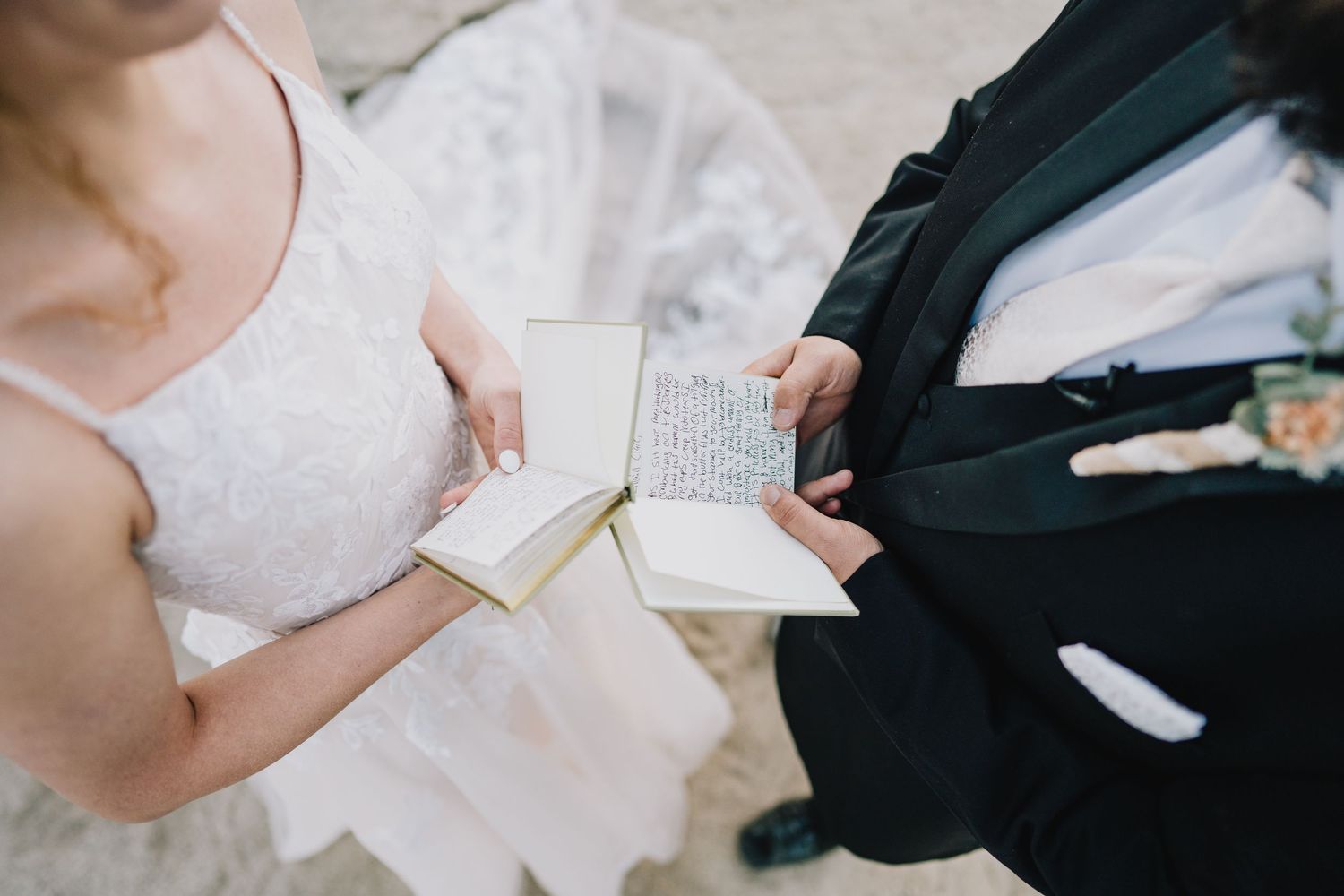 Couple exchanging handwritten vows during wedding ceremony. Yosemite national Park, California