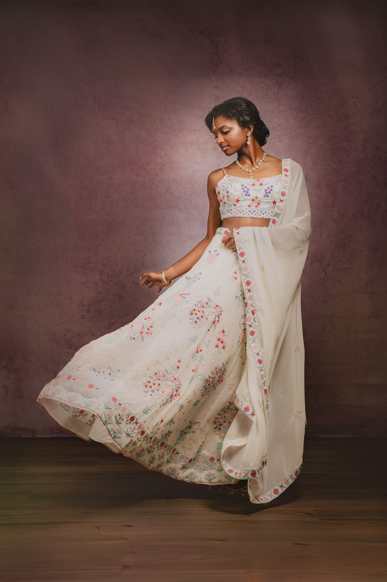 A fashion portrait featuring a flowing white floral dress with embroidered details. Murfreesboro, Tennessee.