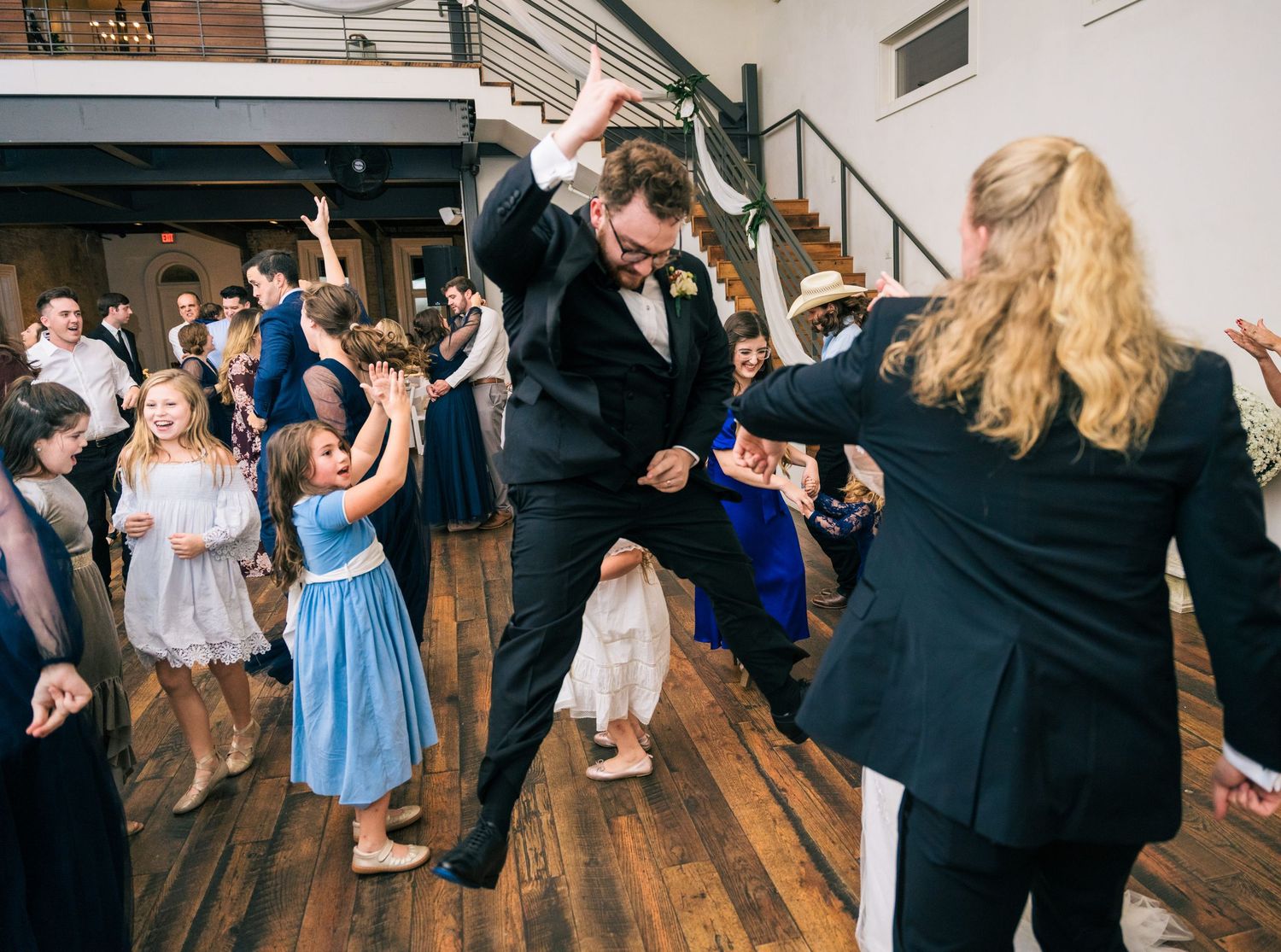 Wedding guests dancing and celebrating at reception venue. Nashville, Tennessee. The Cordelle.