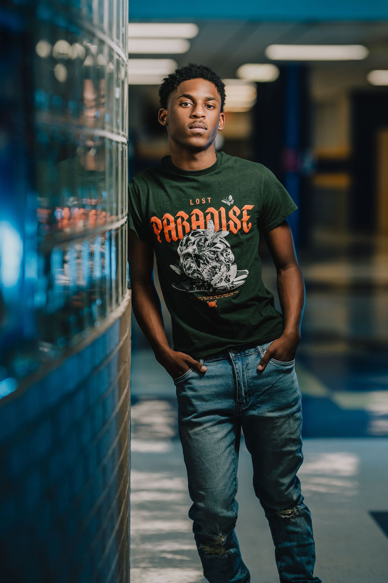 Urban fashion portrait in hallway with blue lighting and vintage graphic t-shirt. Nashville, Tennessee.