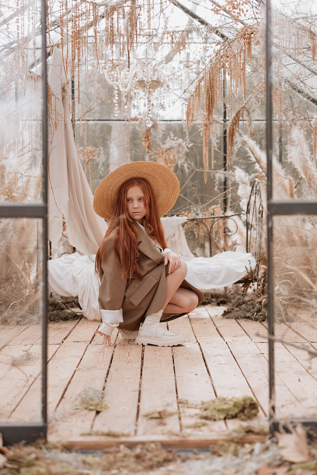 A dreamy greenhouse scene with wooden floors and hanging decor creates a romantic vintage atmosphere.