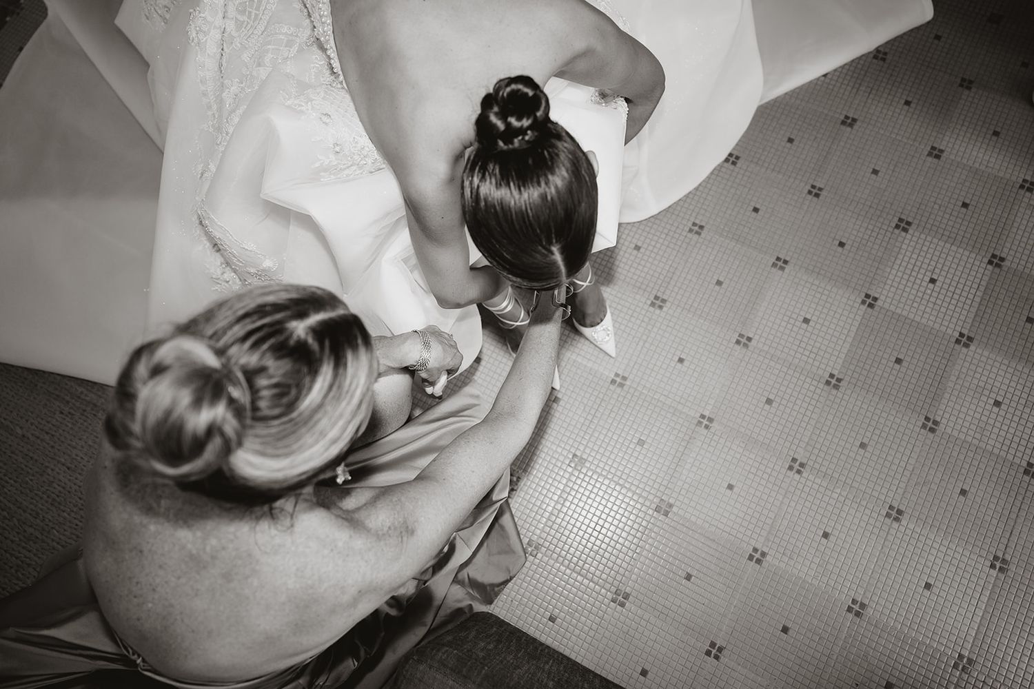 Black and white images showing bridal preparations on patterned carpet.