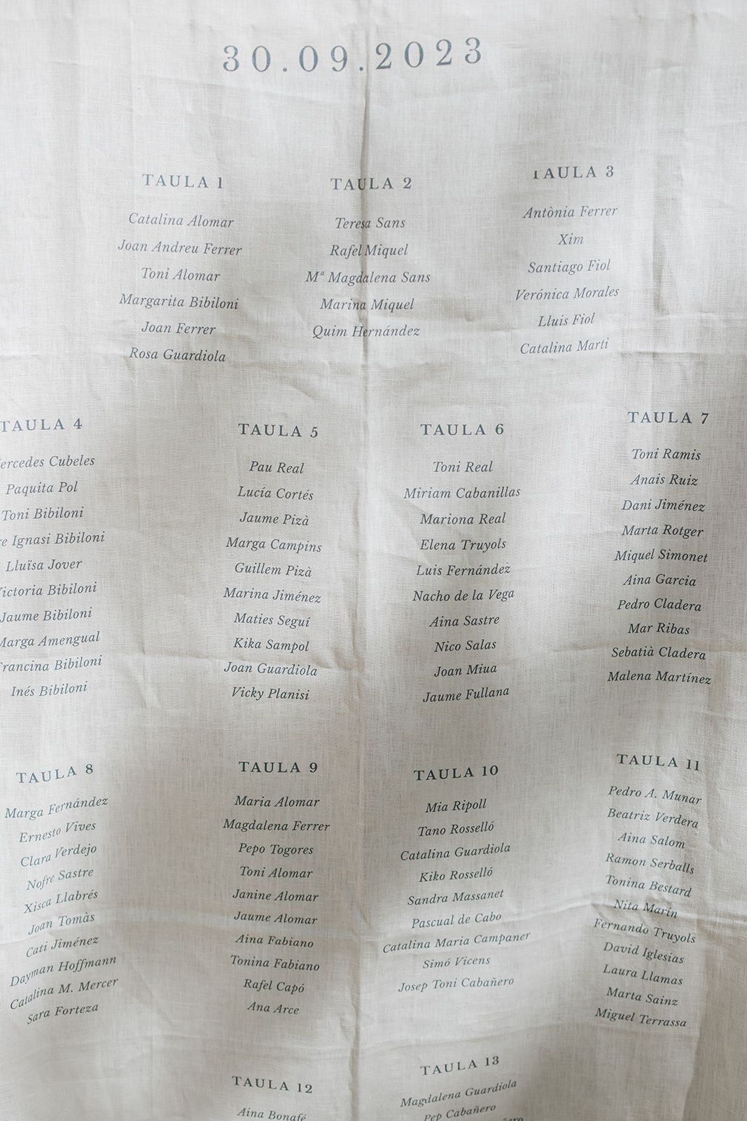 A wedding seating chart showing table assignments dated September 30, 2023.