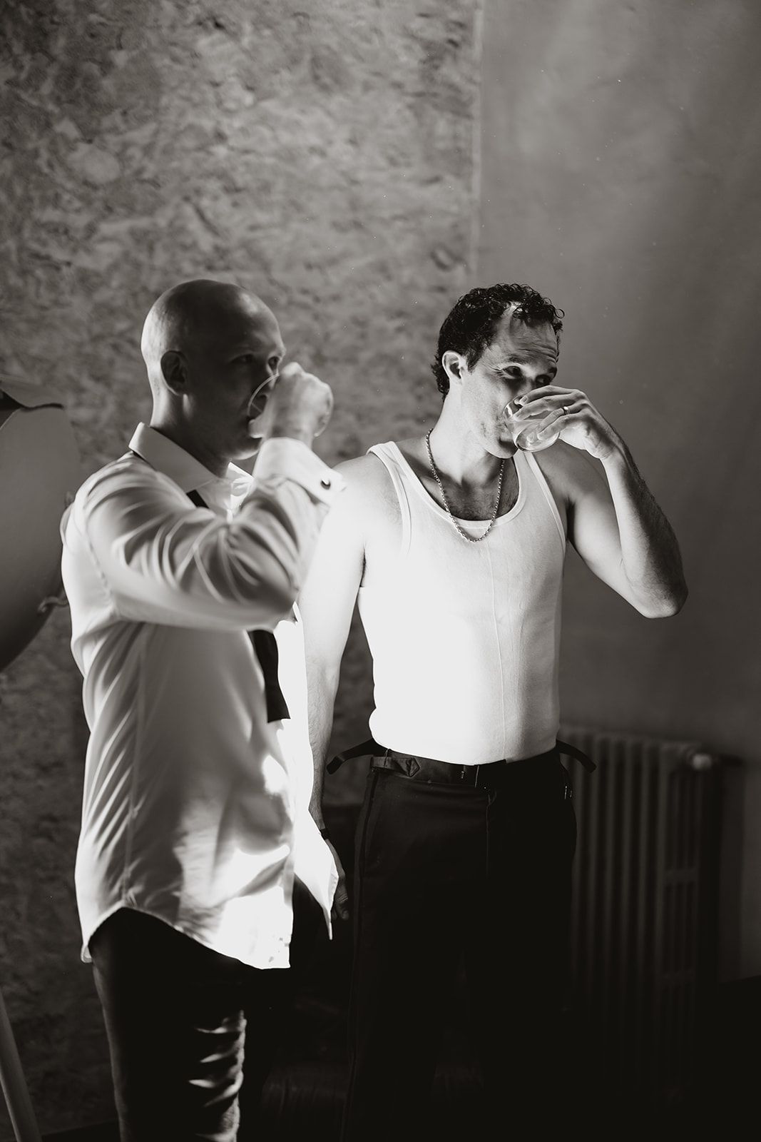 Black and white portrait series showing preparations in formal white attire.