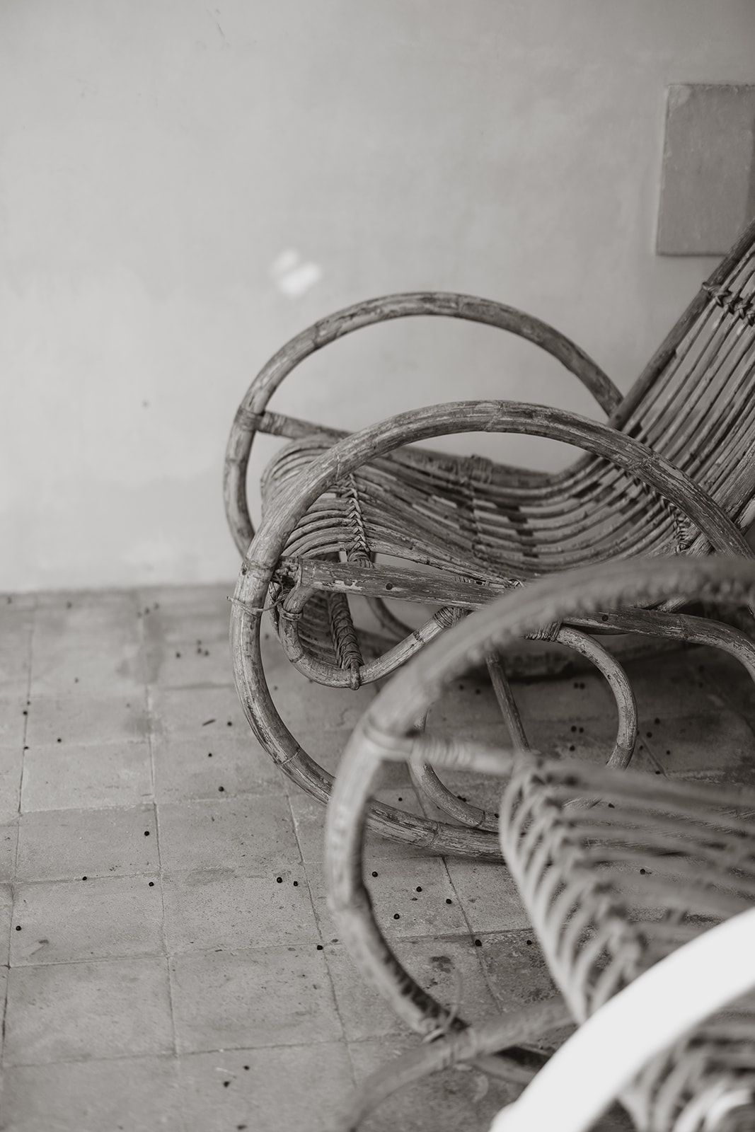 Abstract black and white close-up of curved wooden furniture details.