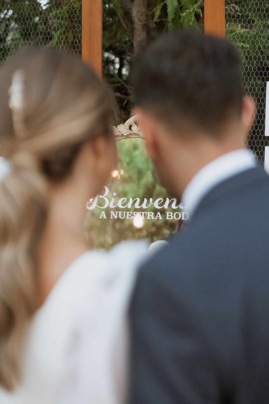 Wedding ceremony backdrop with rustic wooden details and natural decor.