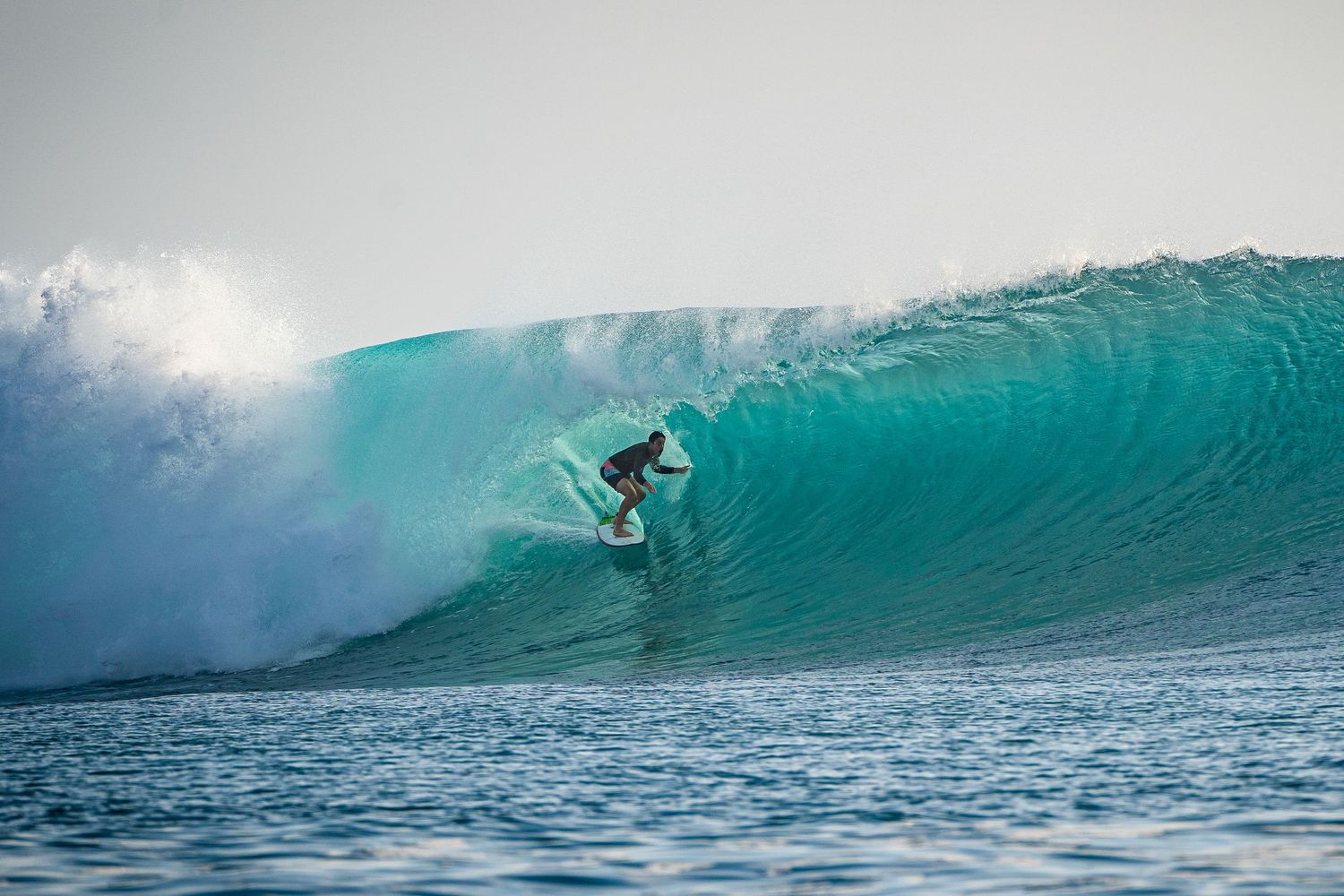 Surfer mid-barrel in epic swell  – CK Surf Mentawai
