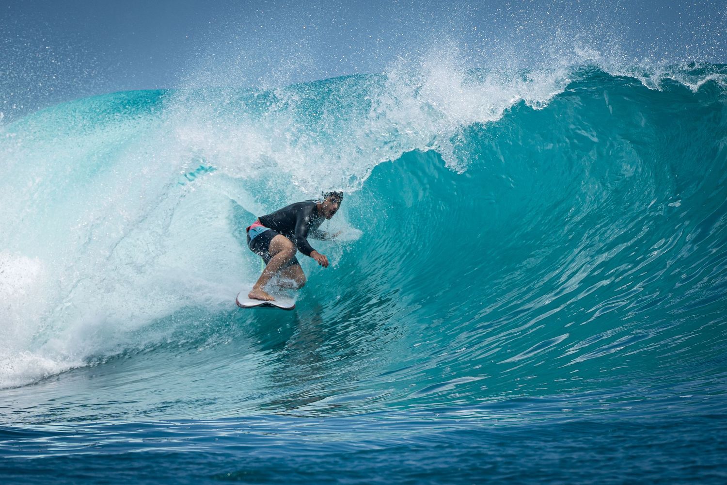 Deep barrel ride, surfer tucked inside turquoise wave – CK Surf Photography