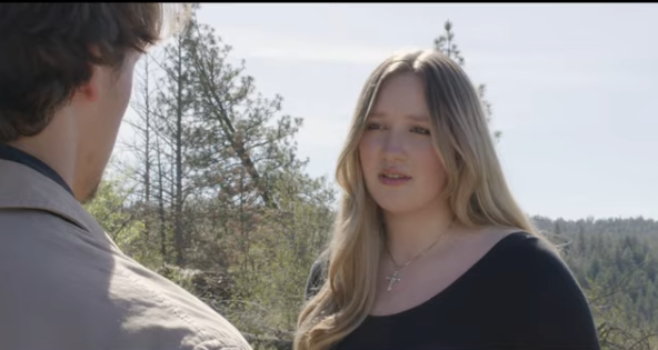 A woman confronts another man about to face death.