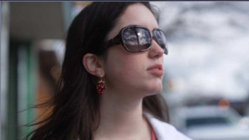 Close-up portrait shots taken in an urban setting.