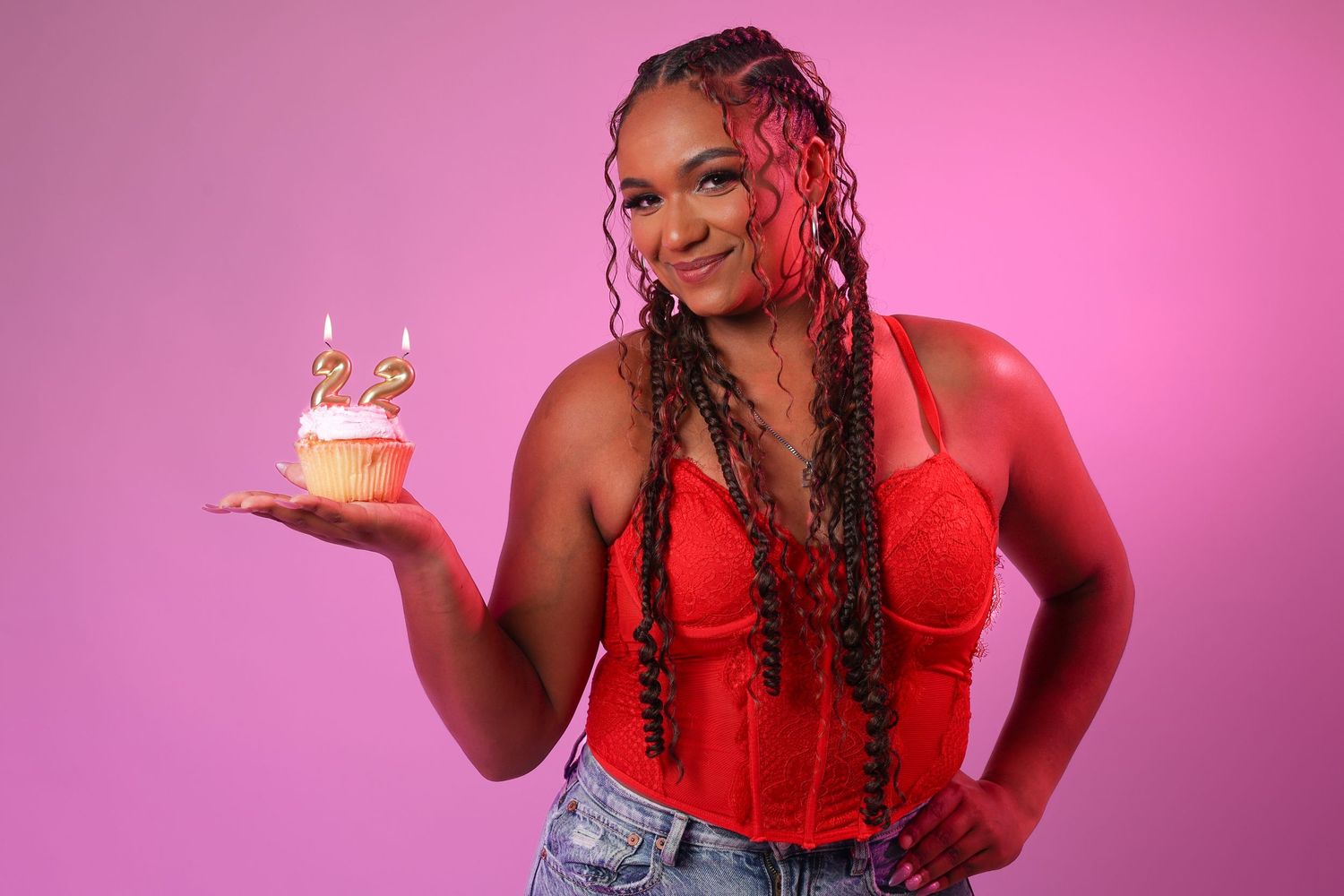 Woman in red top and jeans poses playfully with birthday cake against pink background in photo collage sequence.