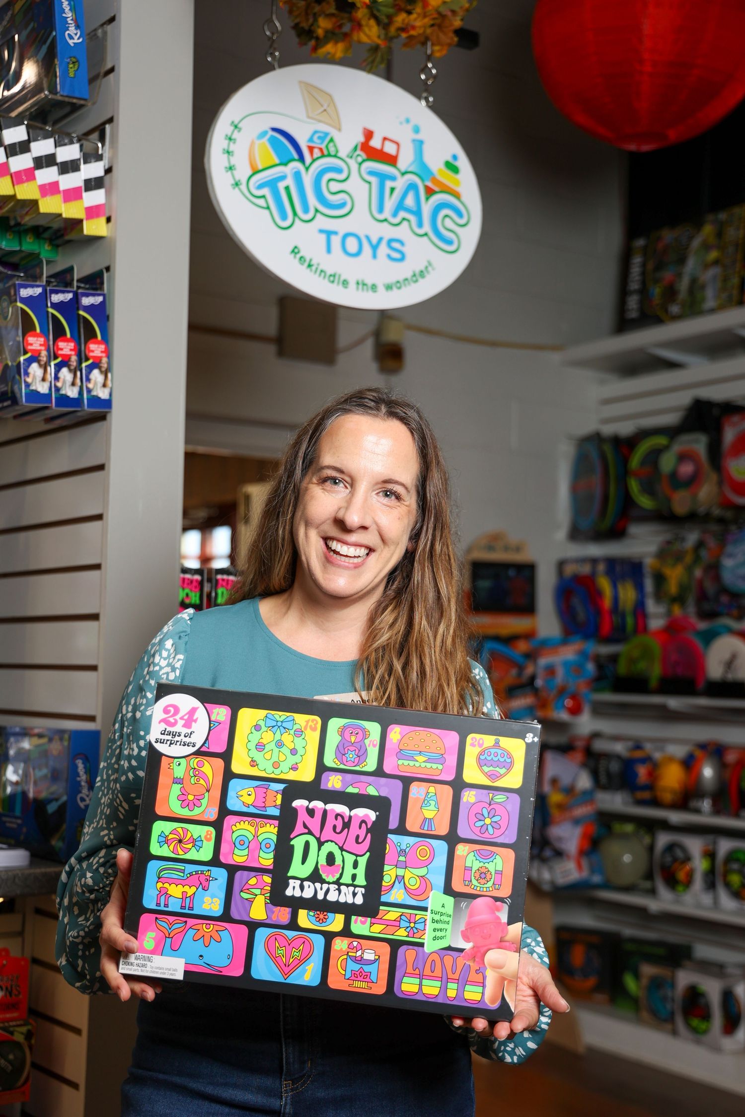 A toy store interior showing colorful displays and shelving with board games and educational toys on display.