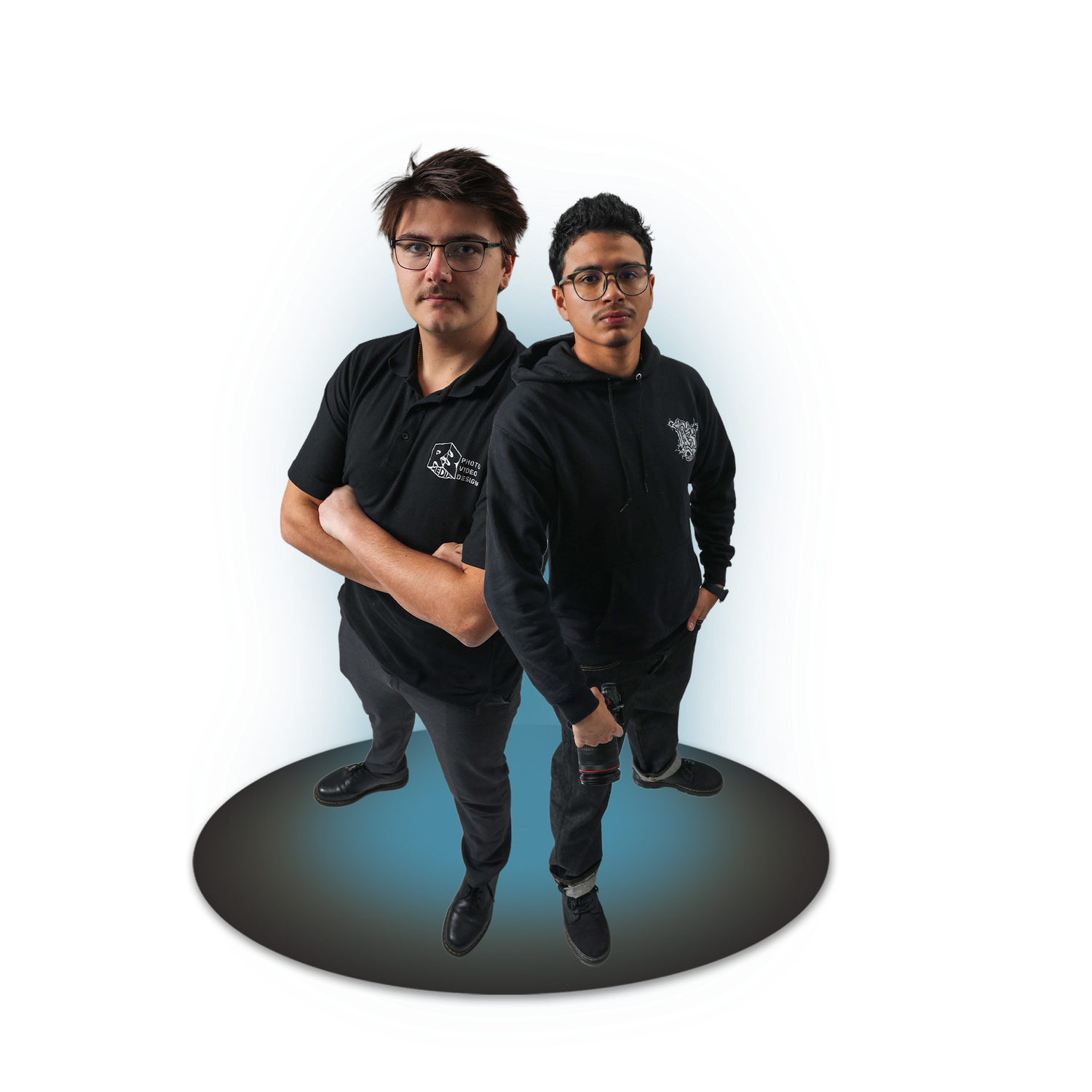 Three people in black clothing photographed from above against a white background.