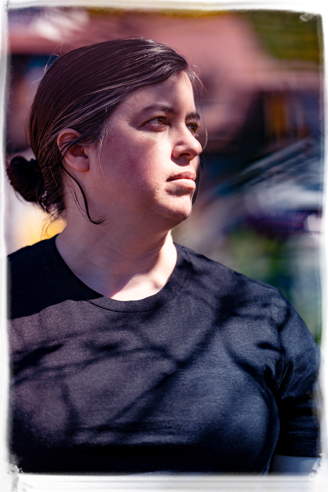 Side profile shots of someone in a black shirt against a blurred background.