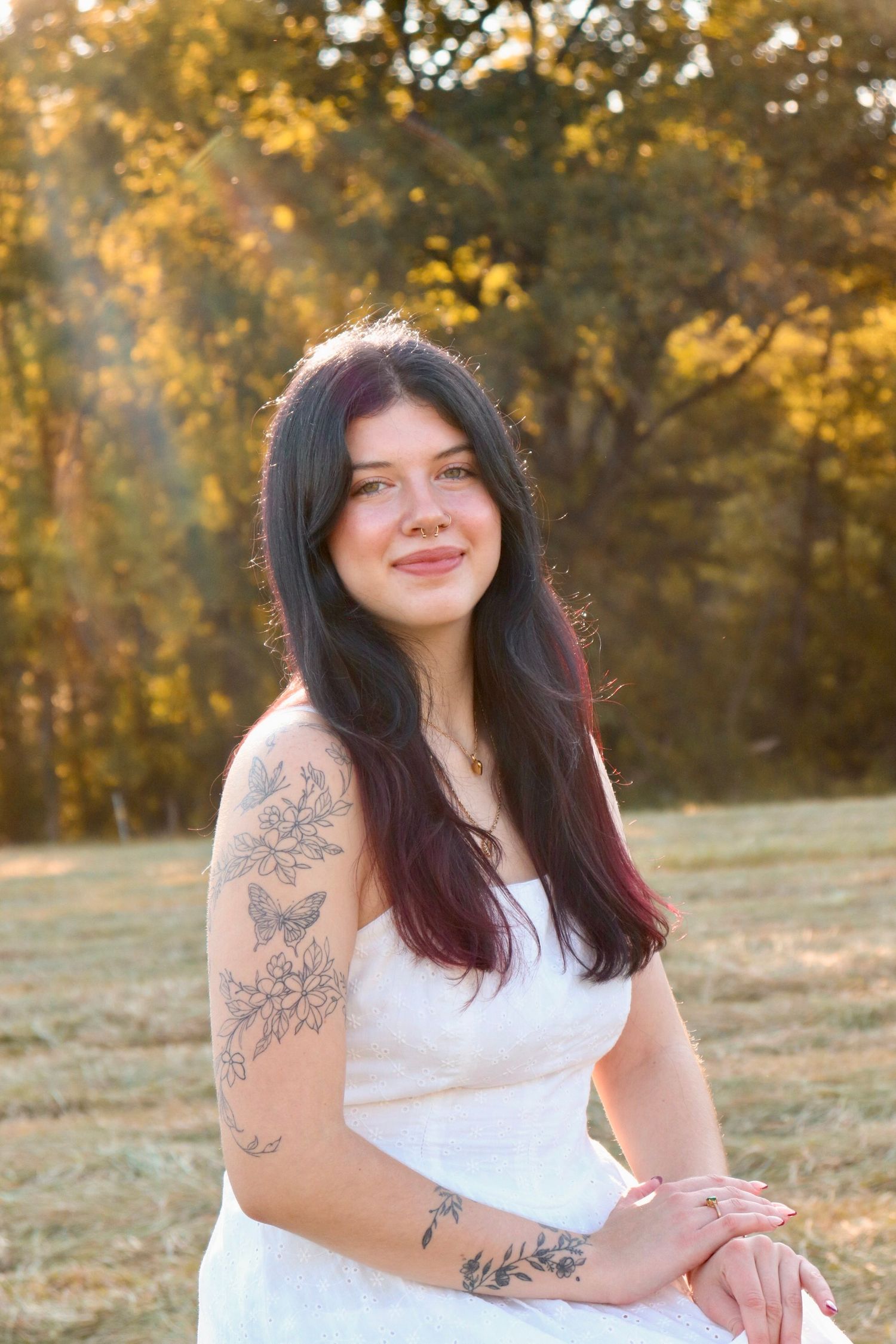 Portrait of a girl in a white dress, taken in warm natural lighting