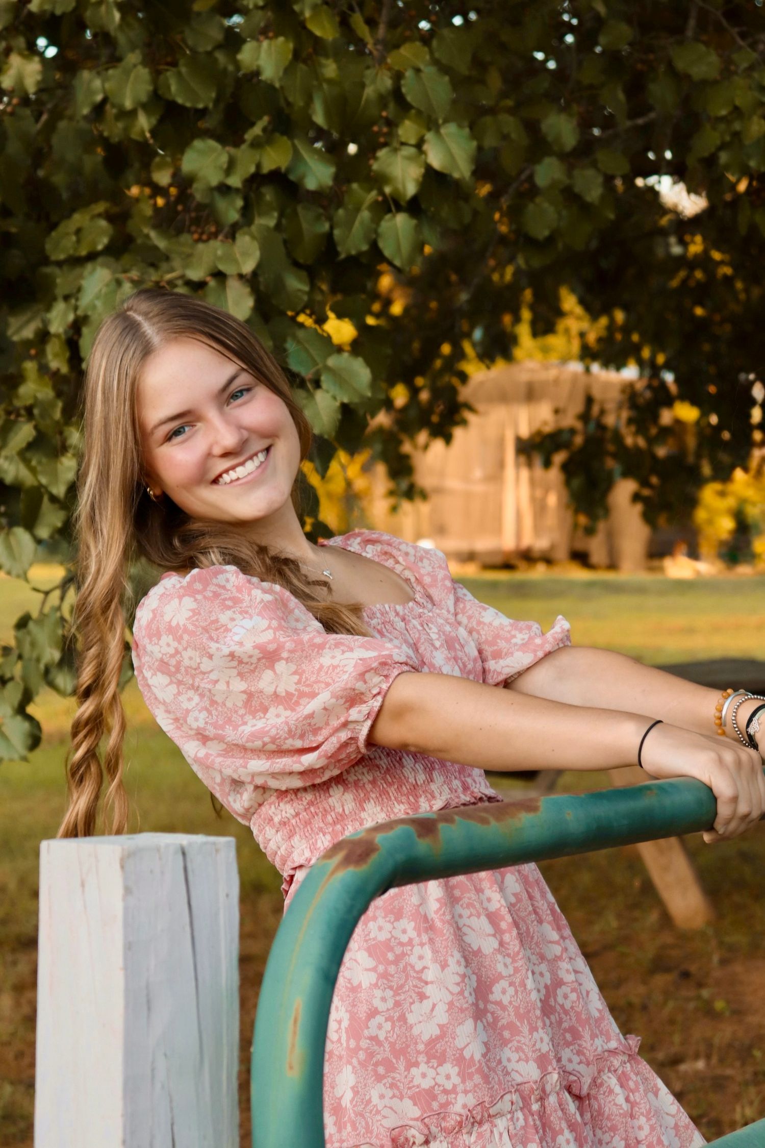 Portrait of a girl in a pink dress, taken in warm natural lighting