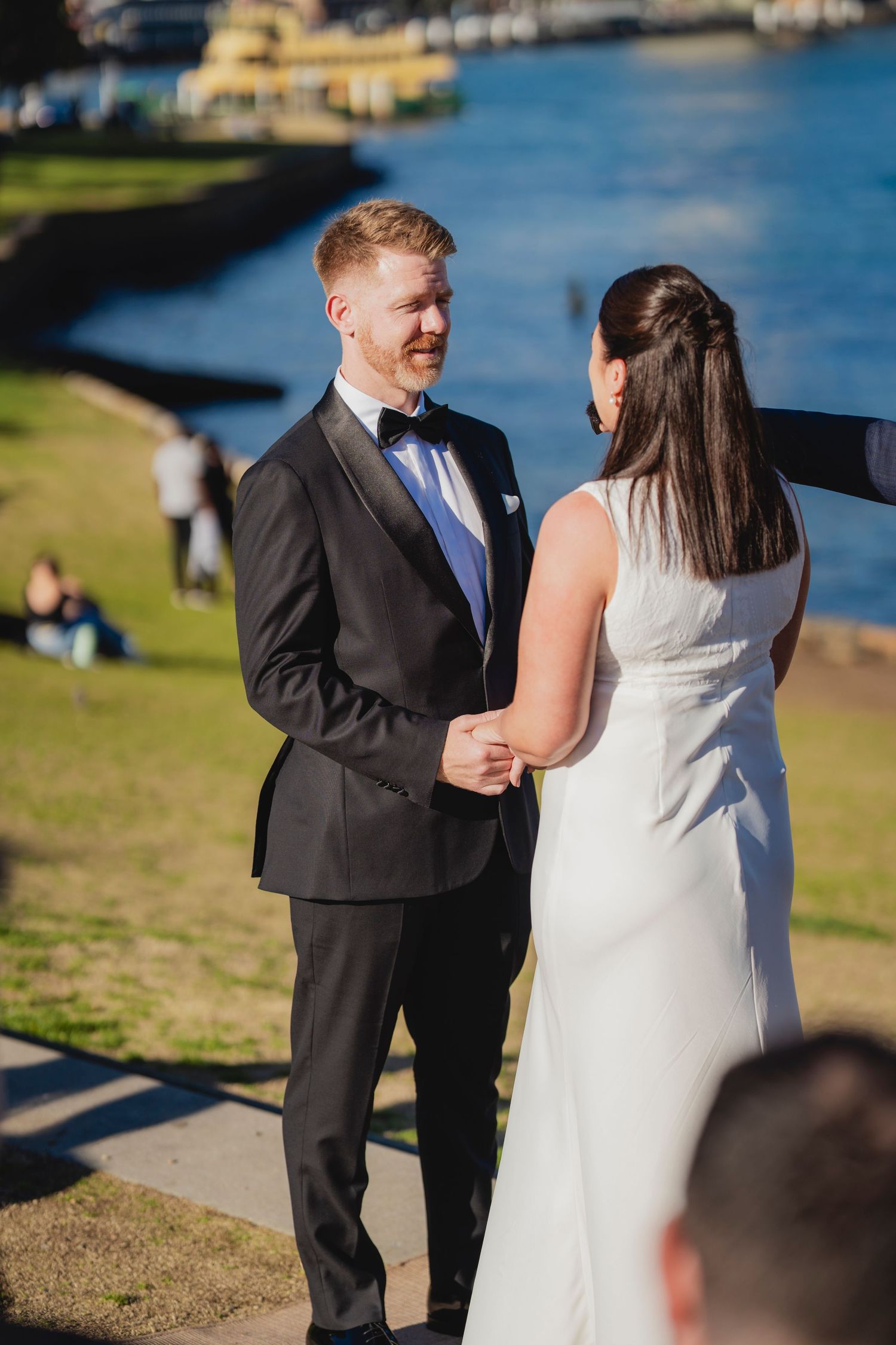 Sydney civil wedding ceremony at Blues Point Reserve, capturing the couple's romantic vows, candid moments and stunning Sydney Harbour views