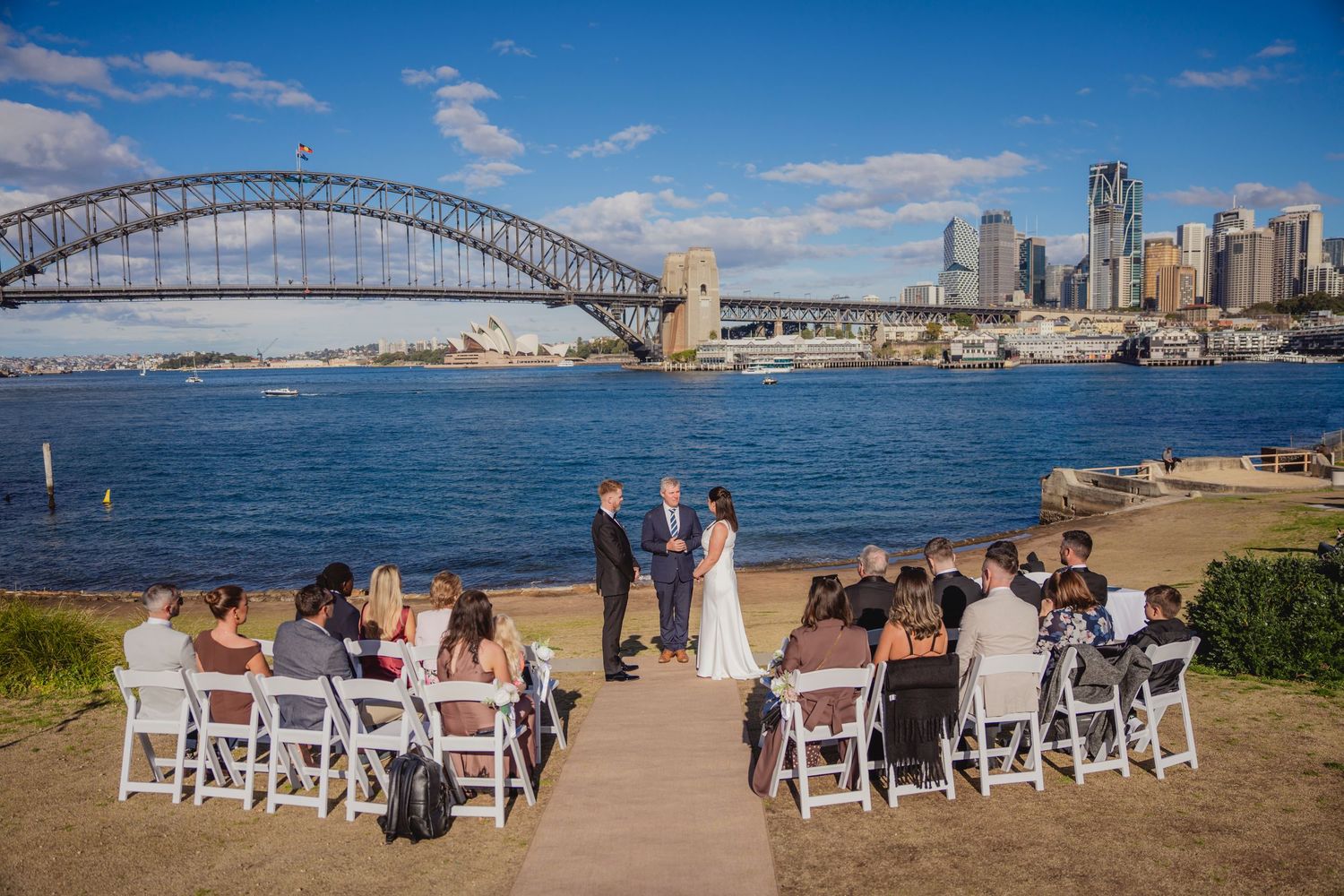 Sydney civil wedding ceremony at Blues Point Reserve, capturing the couple's romantic vows, candid moments and stunning Sydney Harbour views