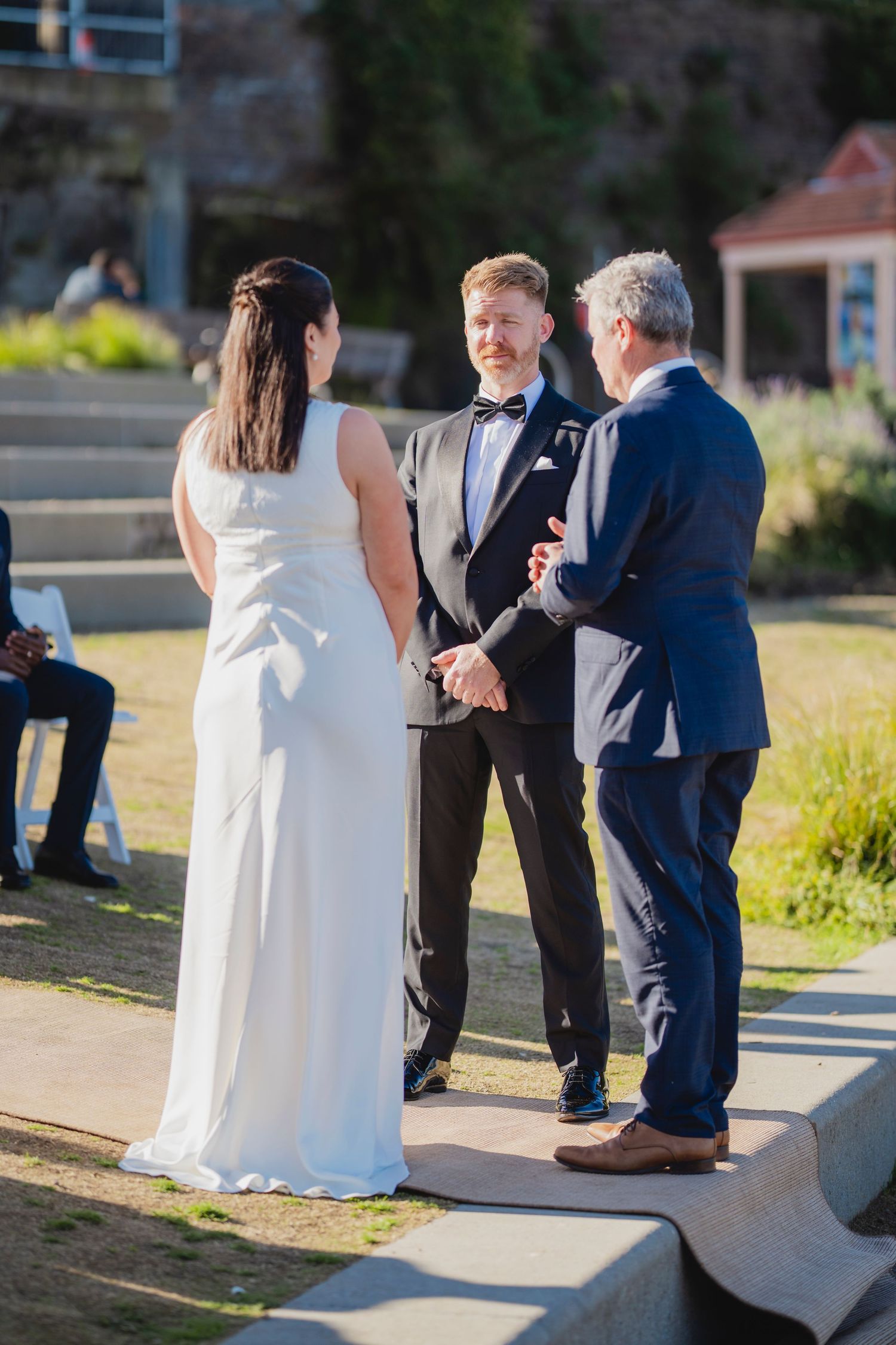 Sydney civil wedding ceremony at Blues Point Reserve, capturing the couple's romantic vows, candid moments and stunning Sydney Harbour views