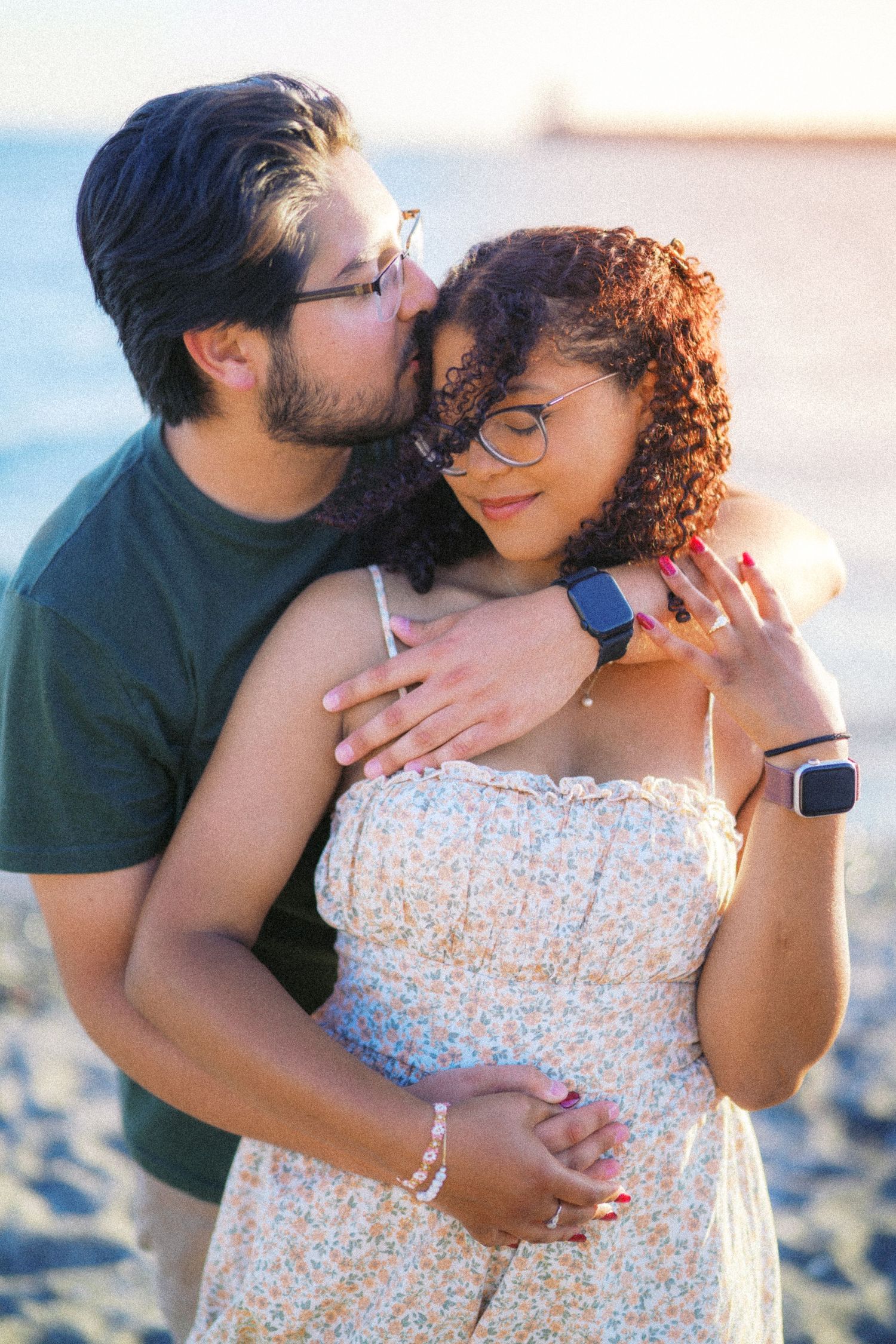 Couple on the beach at golden hour after their Seattle proposal, engagement photos