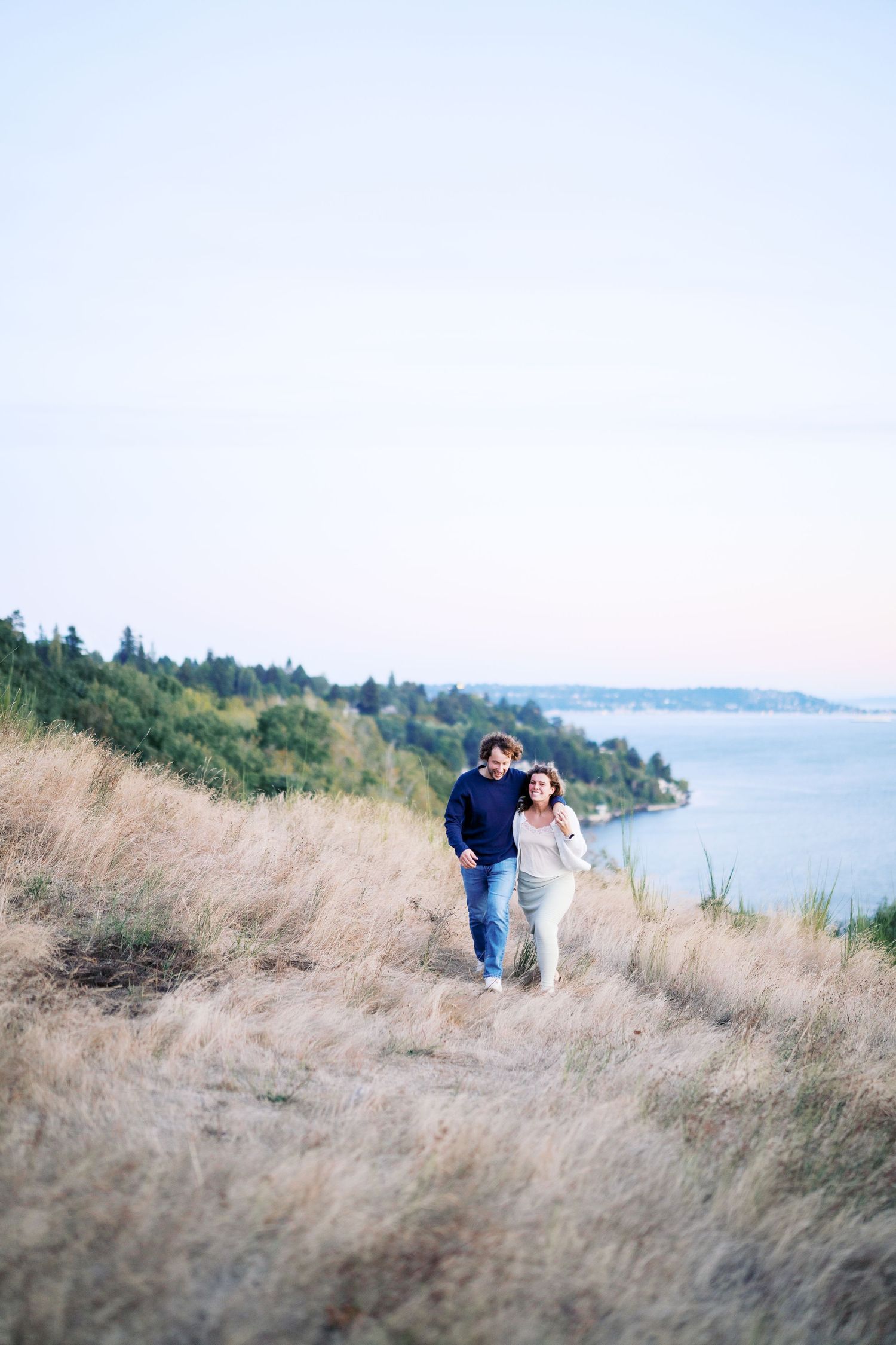 Small figures on the bluff trail above the Sound, Discovery Park proposal photographer, Seattle